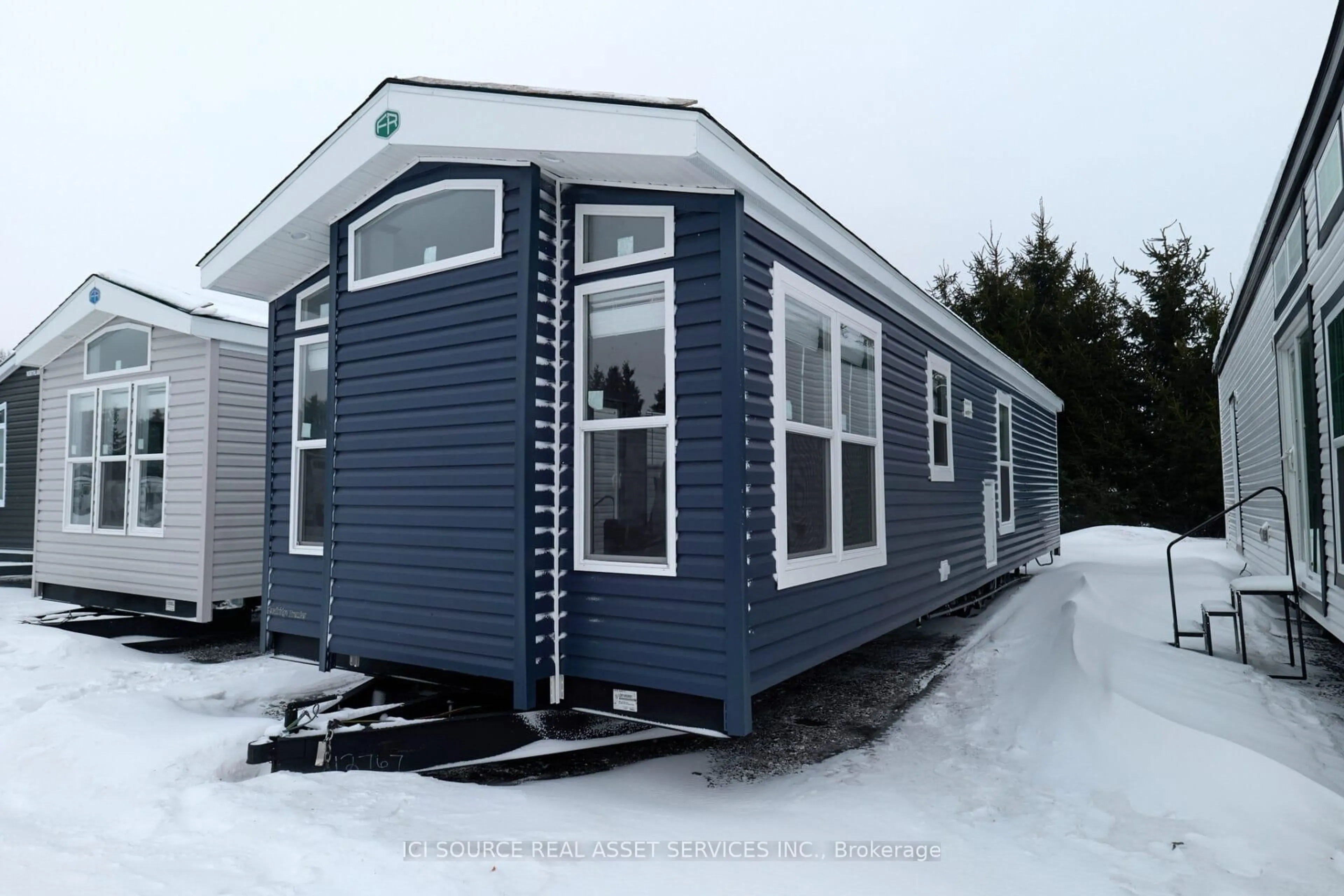 Home with vinyl exterior material, street for 1082 Shamrock Marina Rd #REDWD, Gravenhurst Ontario P0E 1N0