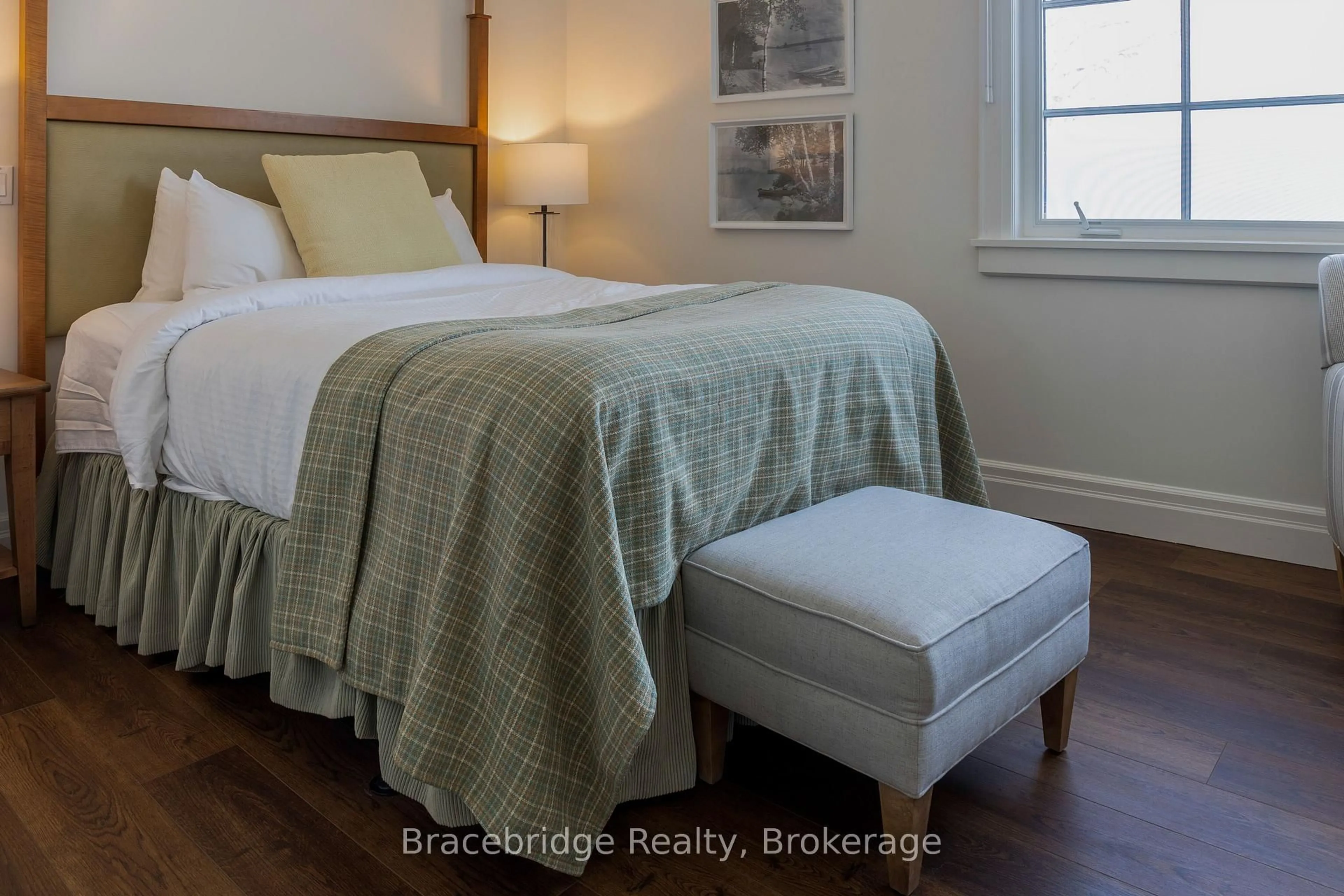 Bedroom with bed, wood/laminate floor for 1869 Muskoka Rd 118 Highway #L205-B1, Muskoka Lakes Ontario P1L 1W8