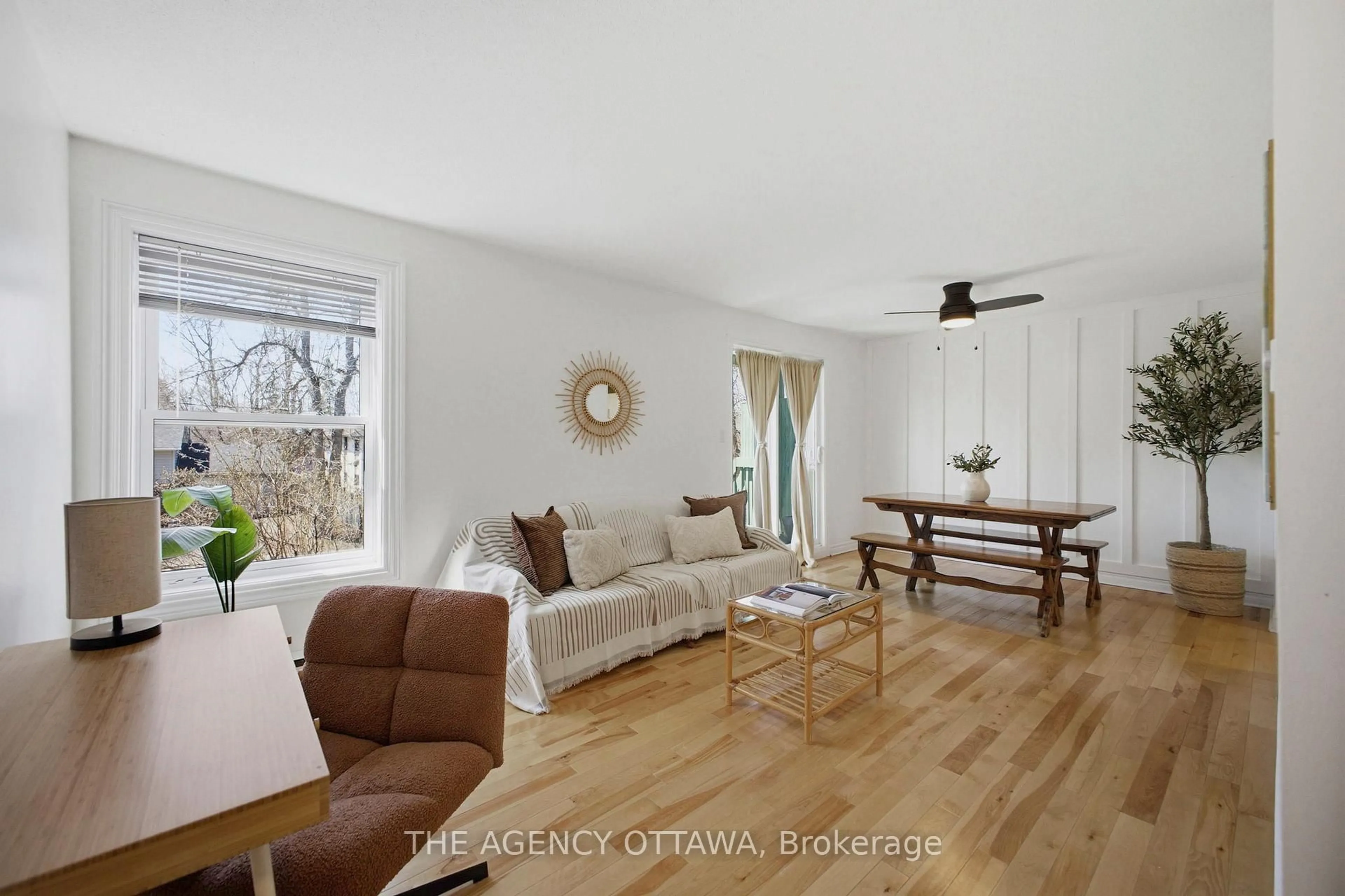 Living room with furniture, wood/laminate floor for 299 Thomas St #103, Carleton Place Ontario K7C 4B8