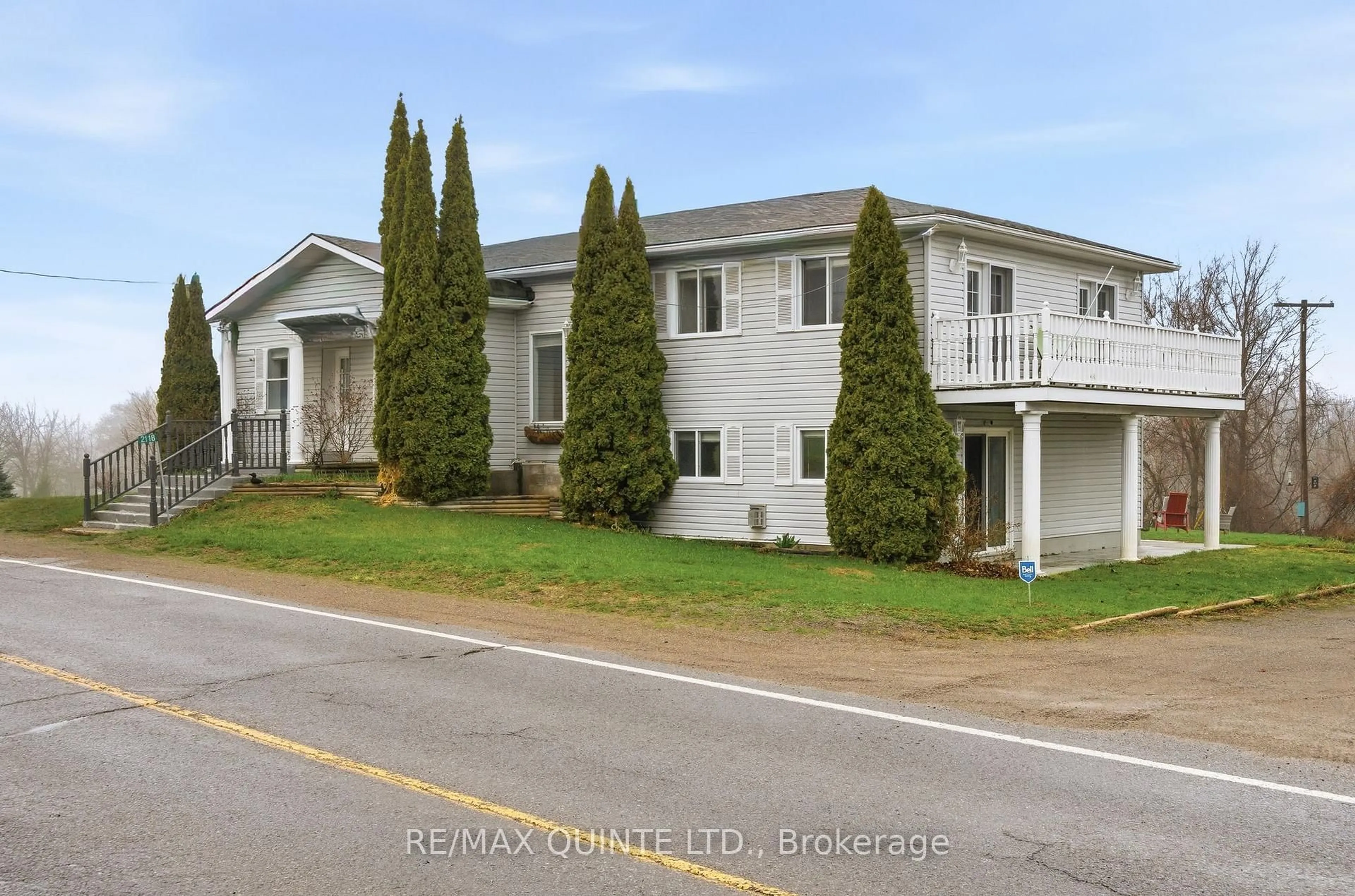 A pic from outside/outdoor area/front of a property/back of a property/a pic from drone, street for 2118 County Road 3 Rd, Prince Edward County Ontario K0K 1L0