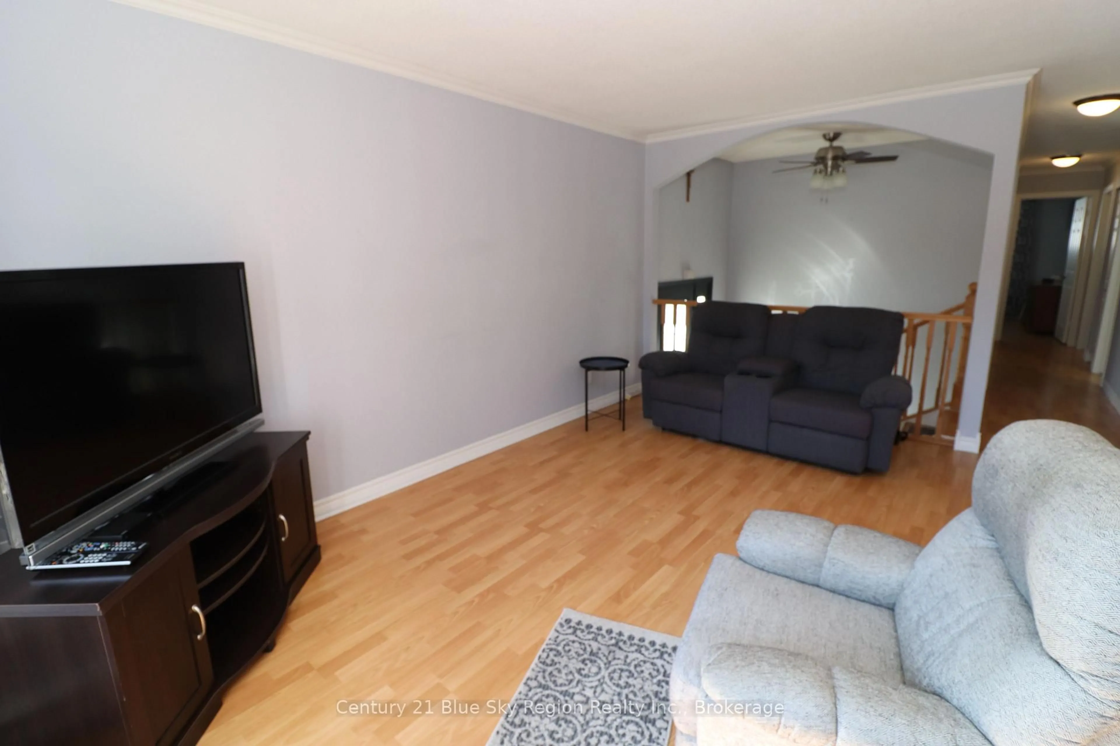Living room with furniture, wood/laminate floor for 85 Whitney Ave, North Bay Ontario P1A 1Y4