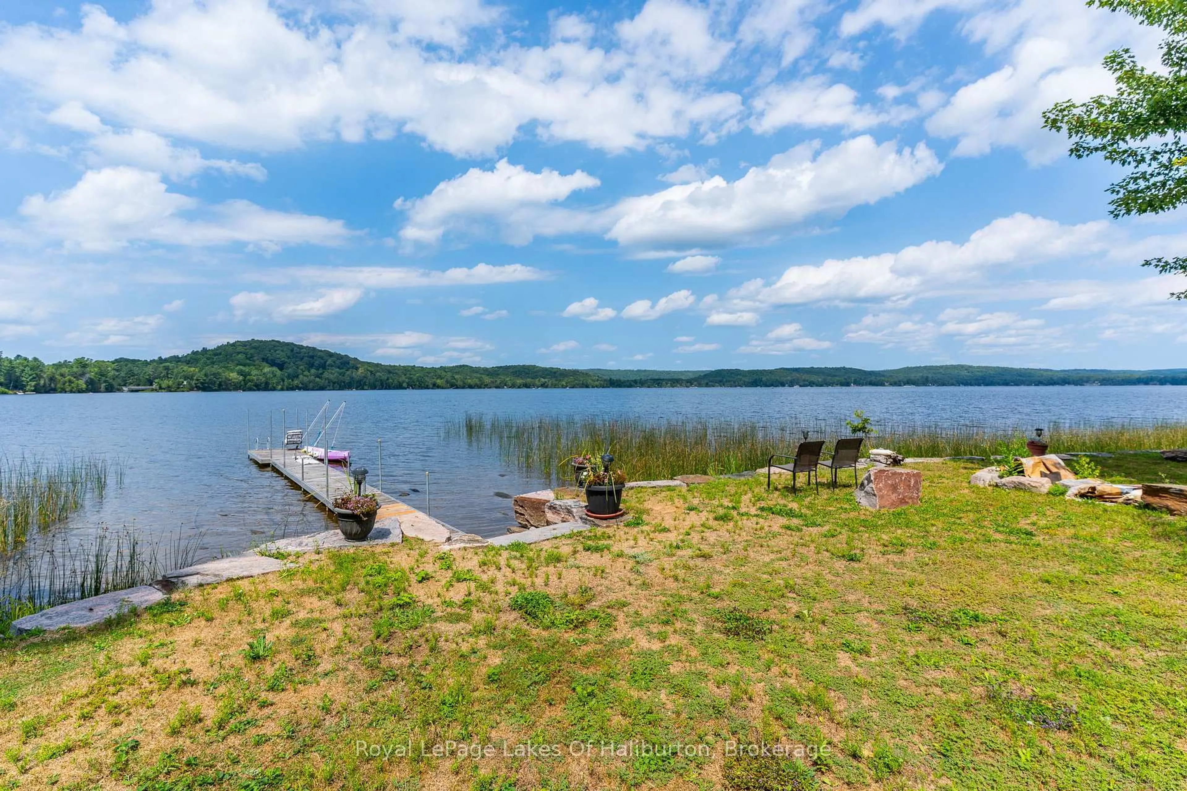 A pic from outside/outdoor area/front of a property/back of a property/a pic from drone, water/lake/river/ocean view for 1049 Ninatigo Lane, Algonquin Highlands Ontario K0M 1S0