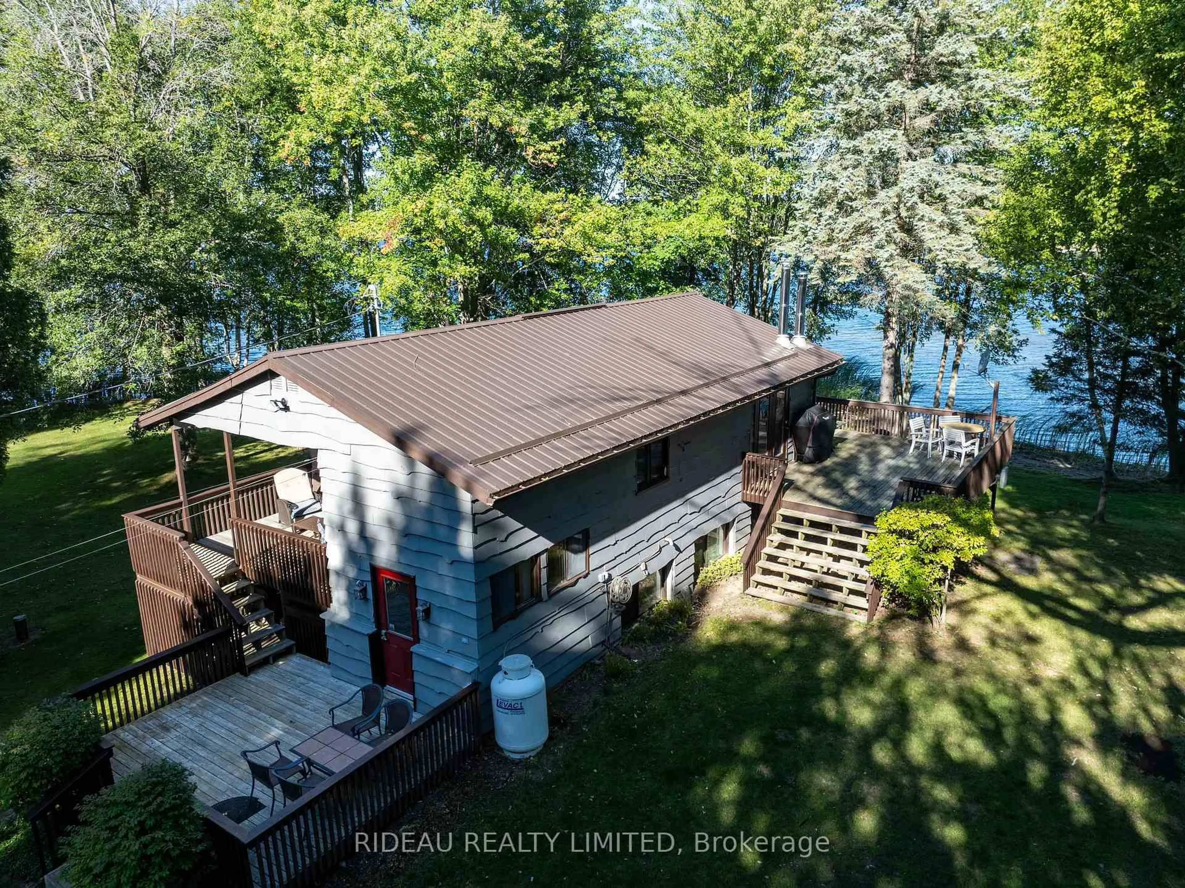 A pic from outside/outdoor area/front of a property/back of a property/a pic from drone, water/lake/river/ocean view for 365 McNamee Lane, Rideau Lakes Ontario K0G 1V0