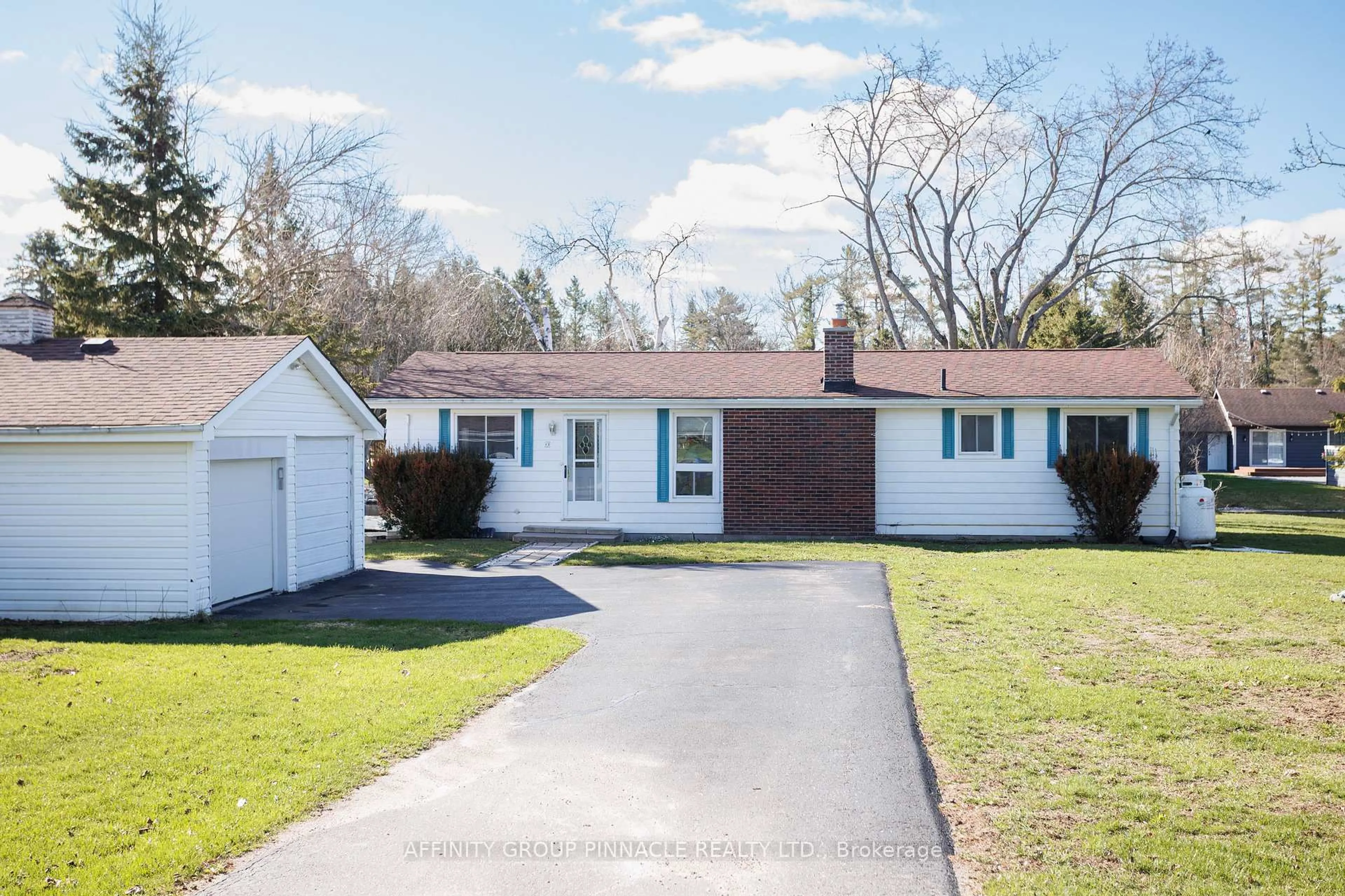 Home with vinyl exterior material, street for 12 North Bayou Rd, Kawartha Lakes Ontario K0M 1N0