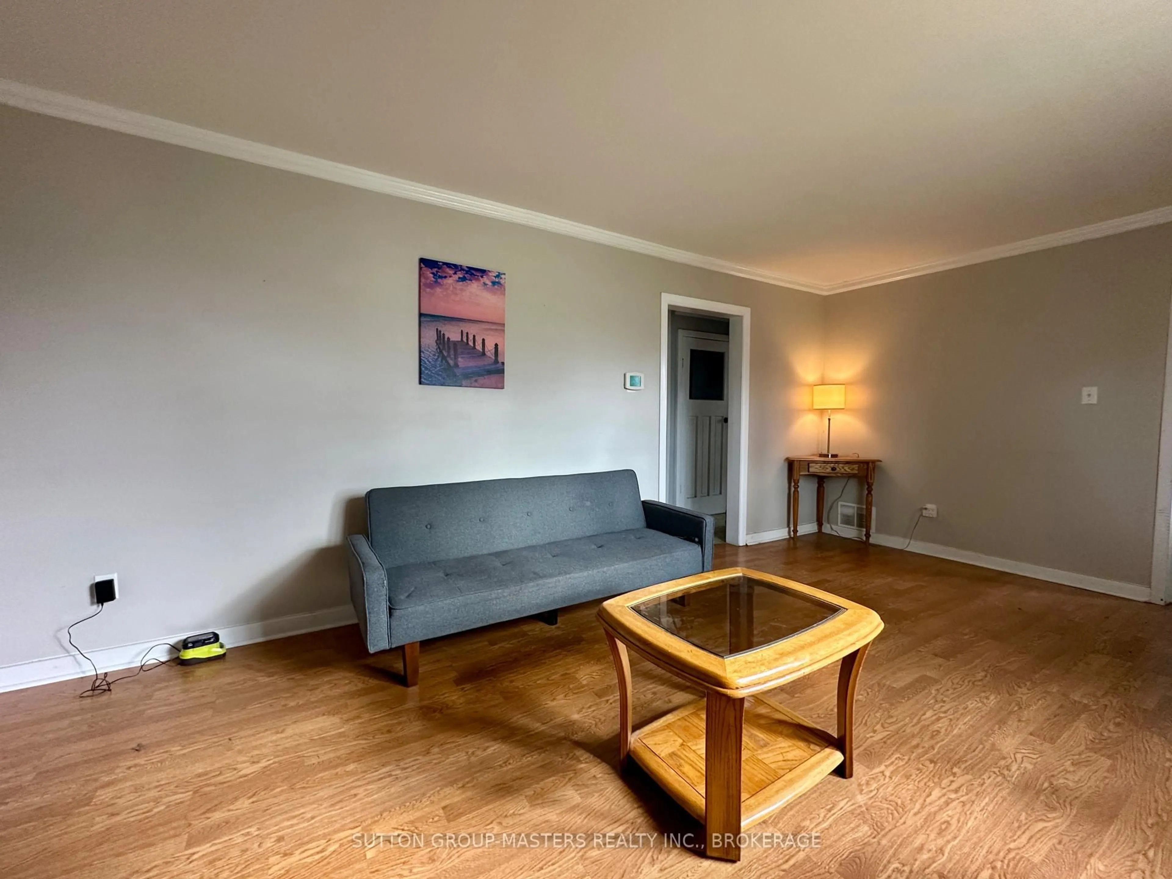 Living room with furniture, wood/laminate floor for 1668 Victoria St, Kingston Ontario K7M 5K3