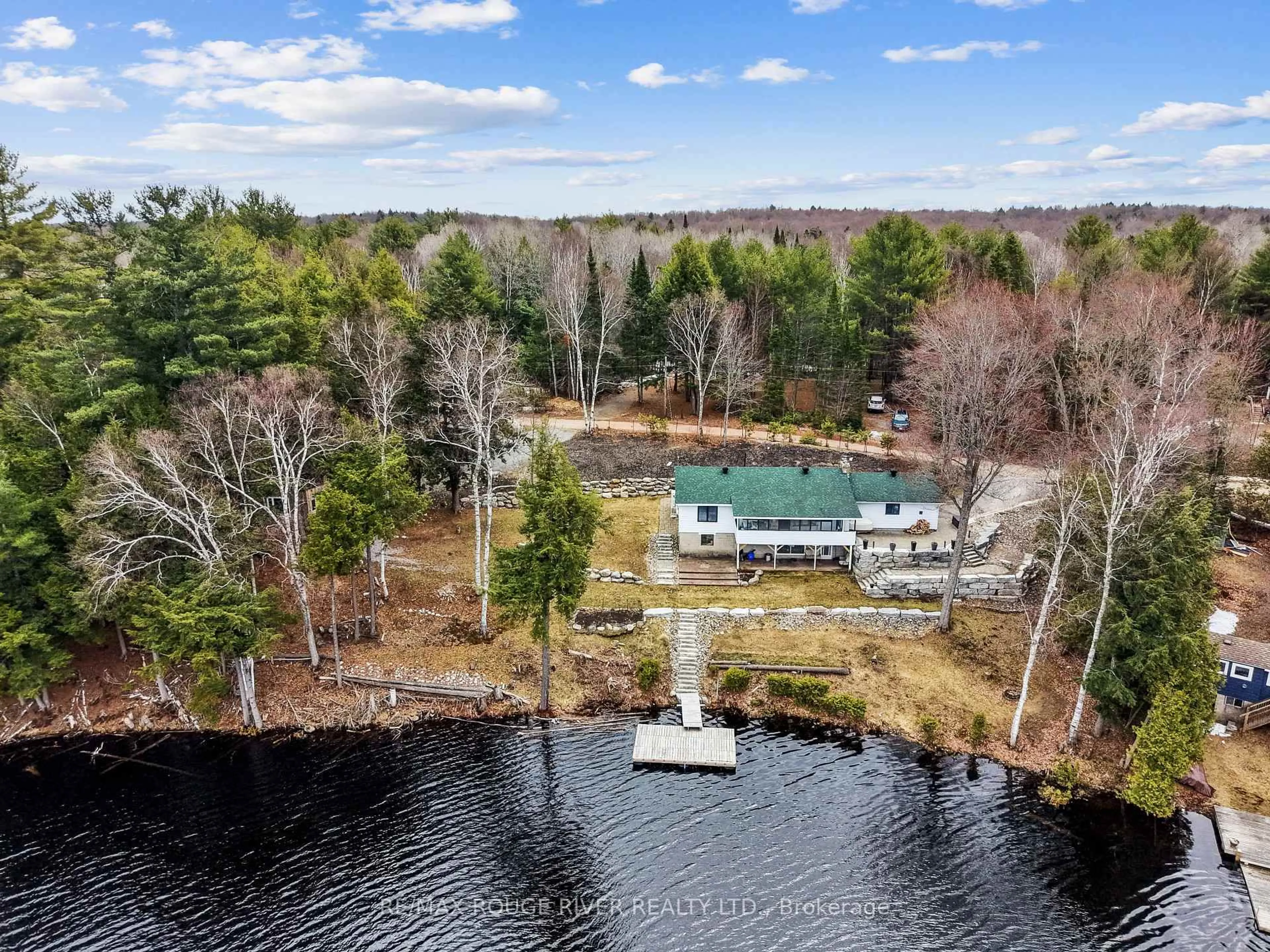 A pic from outside/outdoor area/front of a property/back of a property/a pic from drone, water/lake/river/ocean view for 1087 Lagoon Rd, Highlands East Ontario K0L 1C0