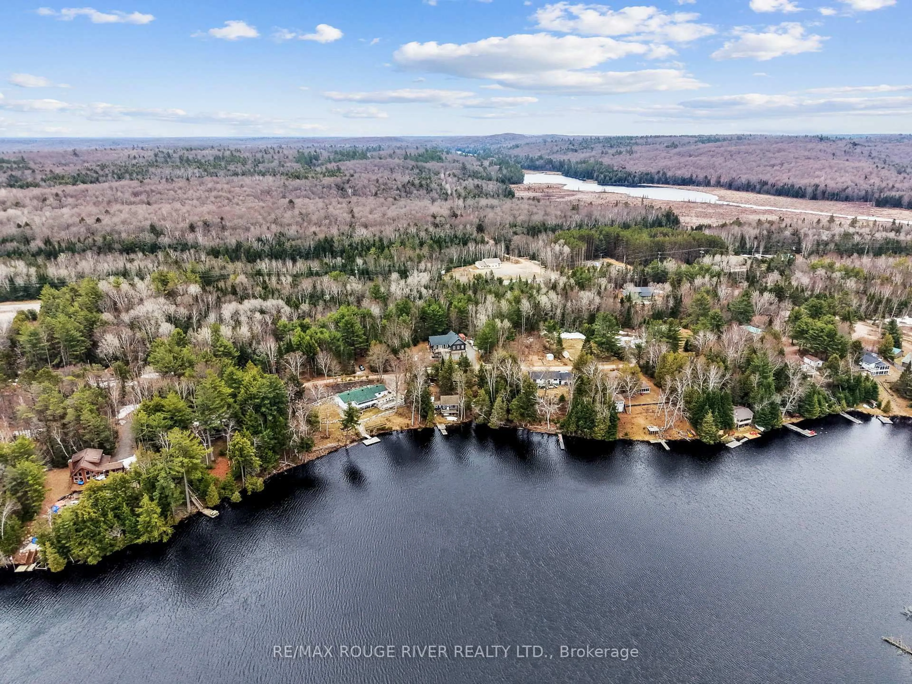 A pic from outside/outdoor area/front of a property/back of a property/a pic from drone, water/lake/river/ocean view for 1087 Lagoon Rd, Highlands East Ontario K0L 1C0