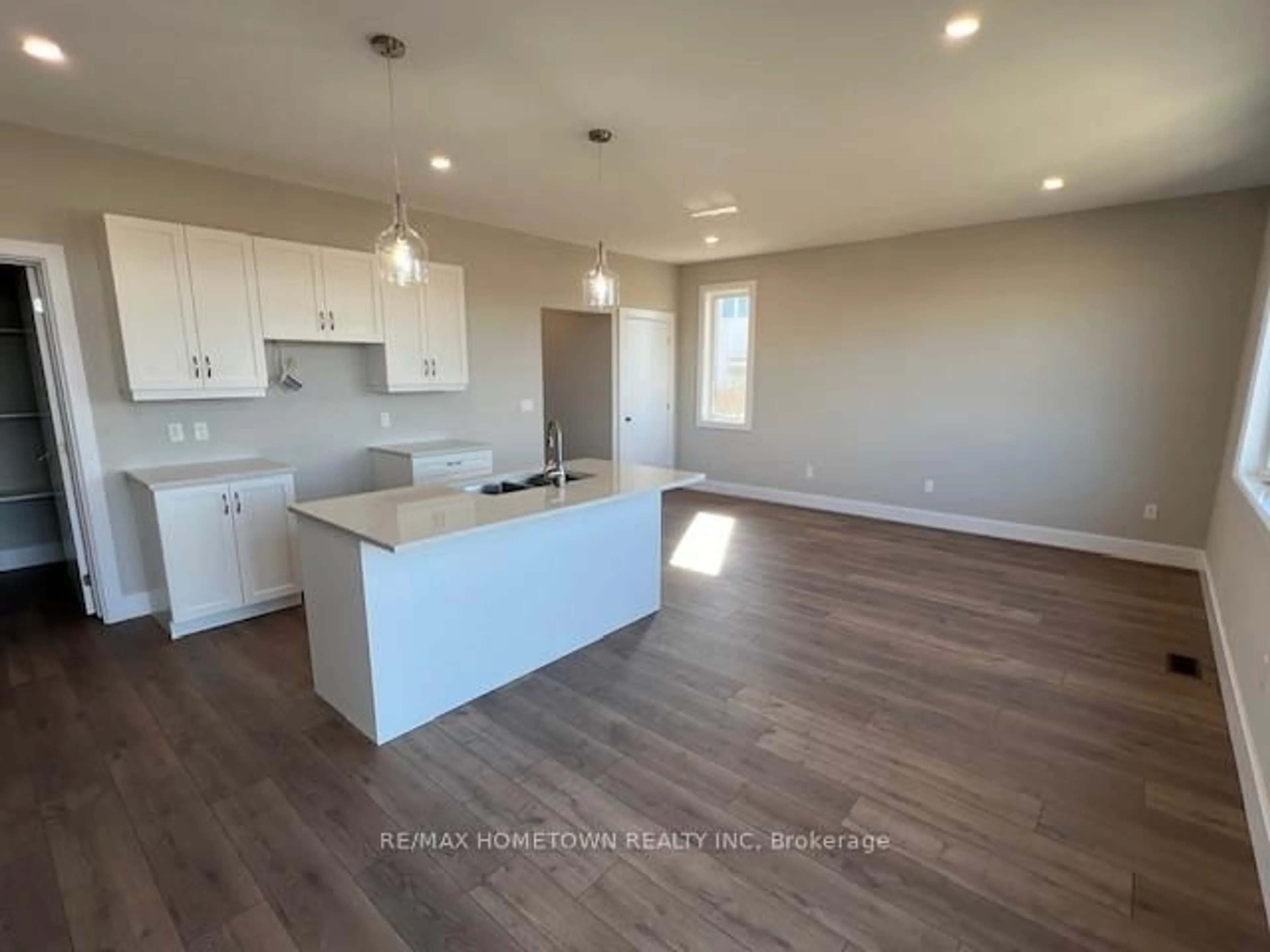 Open concept kitchen, wood/laminate floor for 1013 Dobbie St, Brockville Ontario K6V 7N1