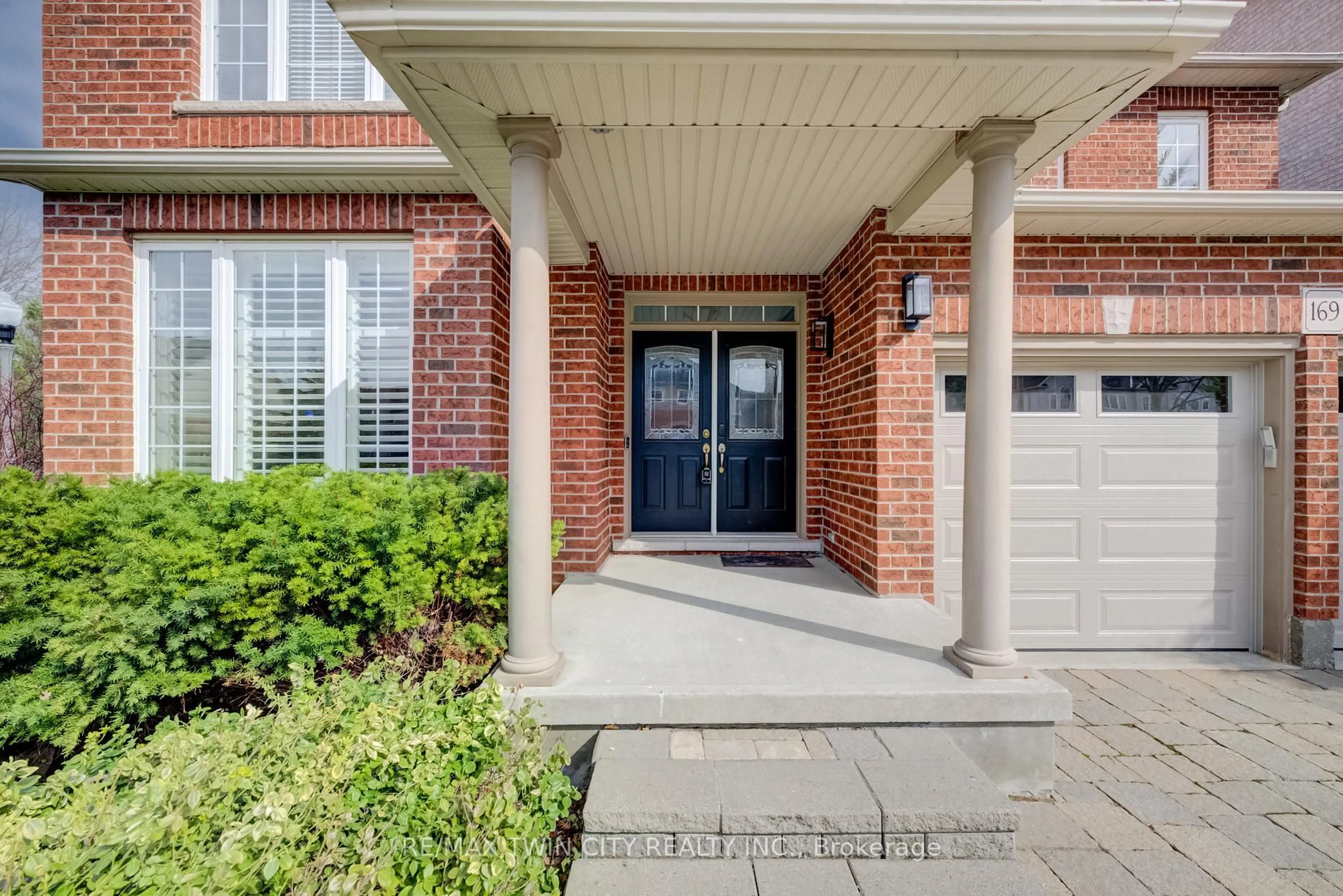 Home with brick exterior material, street for 169 Falconridge Dr, Kitchener Ontario N2K 4J9