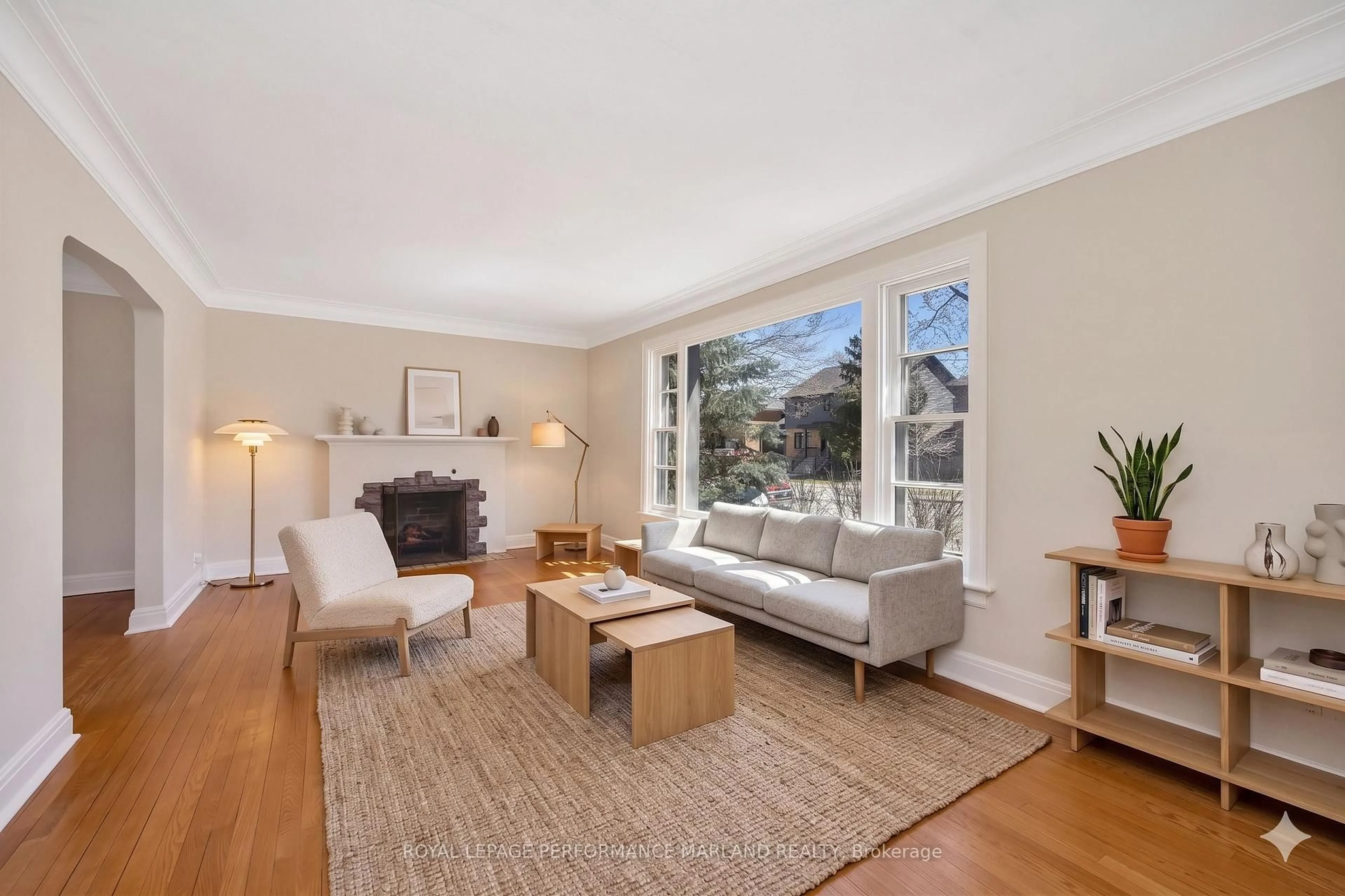 Living room with furniture, wood/laminate floor for 65 Southern Dr, Ottawa Ontario K1S 0P5