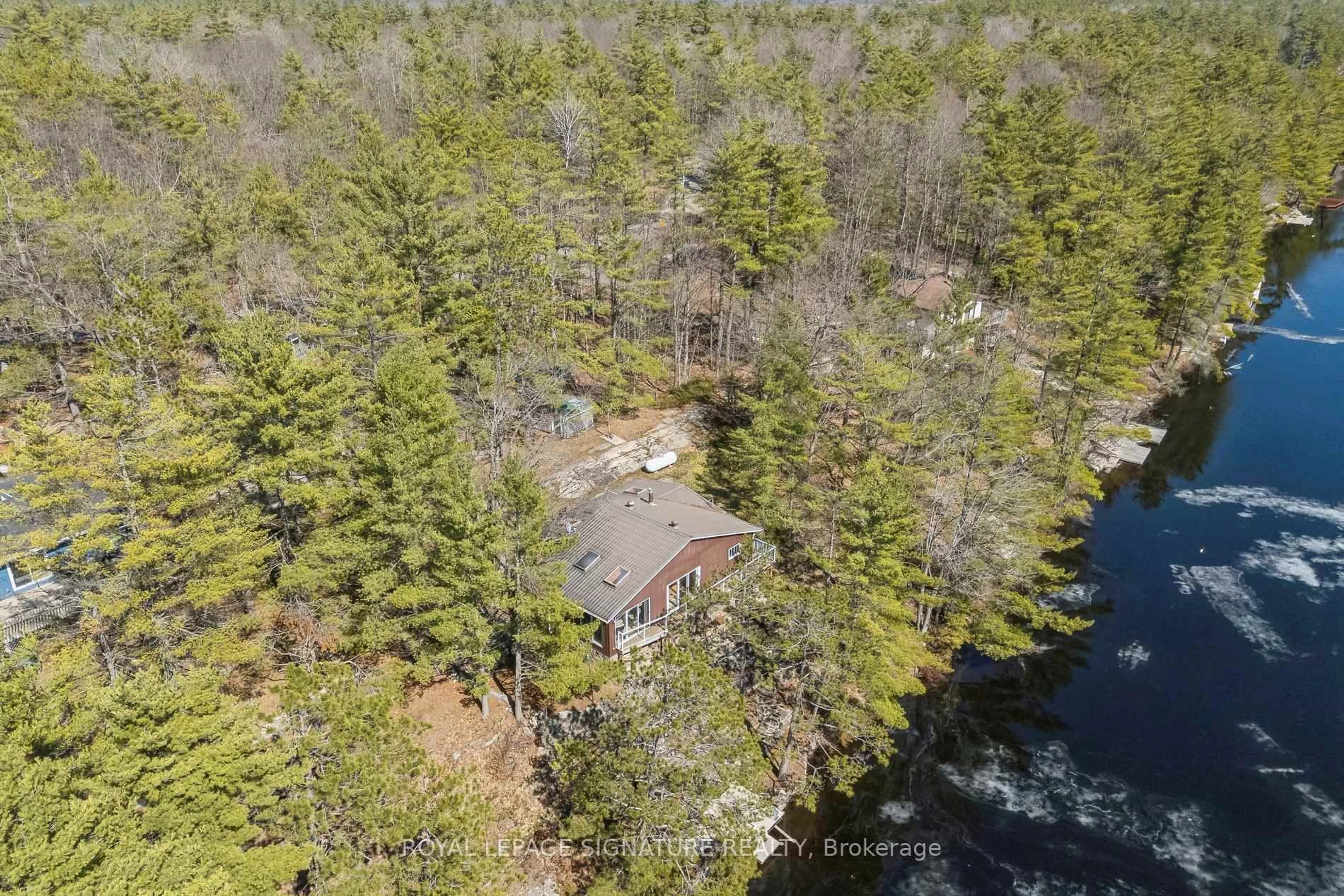 A pic from outside/outdoor area/front of a property/back of a property/a pic from drone, water/lake/river/ocean view for 18 Loon Lake Rd, Gravenhurst Ontario P1P 1R2