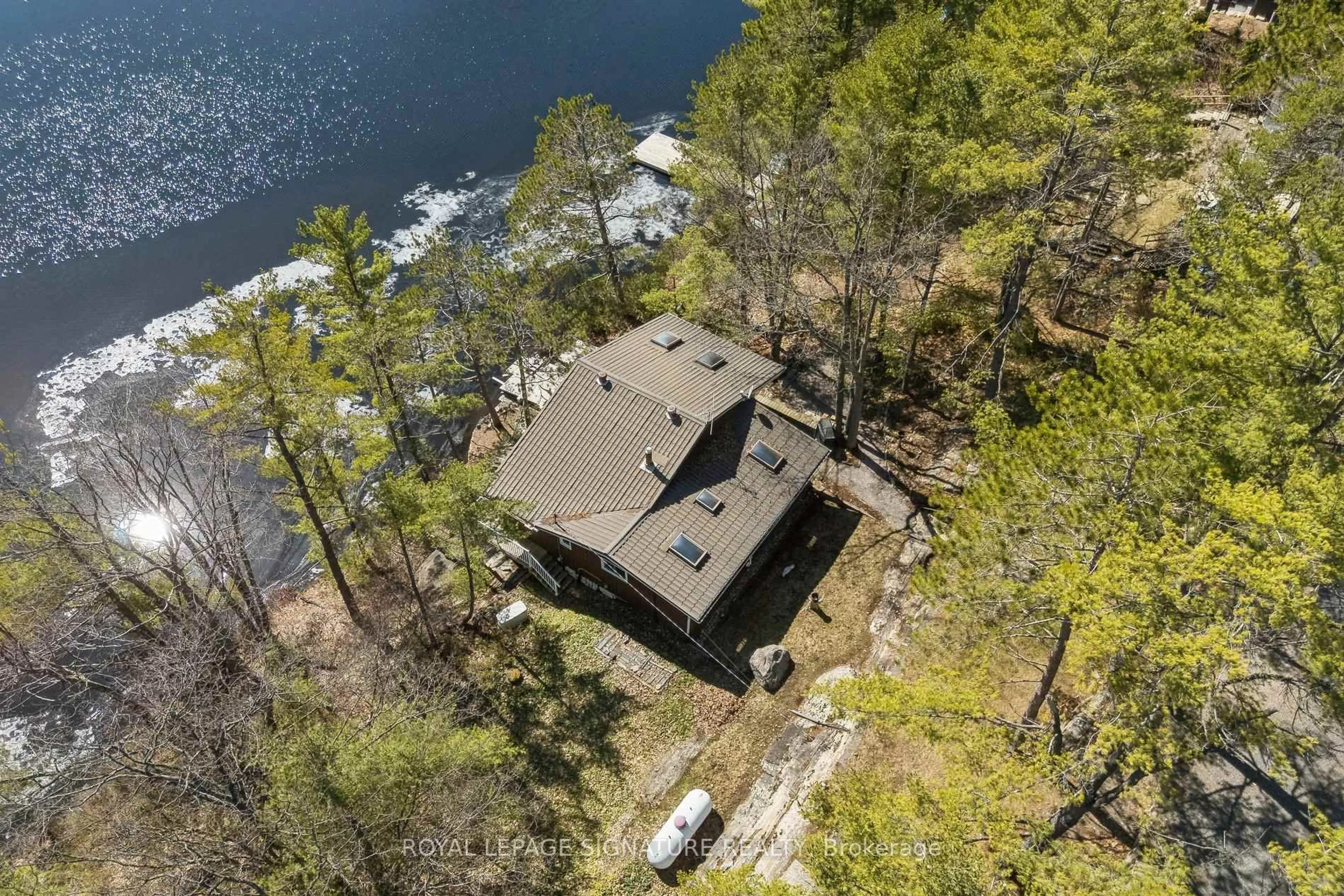 A pic from outside/outdoor area/front of a property/back of a property/a pic from drone, water/lake/river/ocean view for 18 Loon Lake Rd, Gravenhurst Ontario P1P 1R2