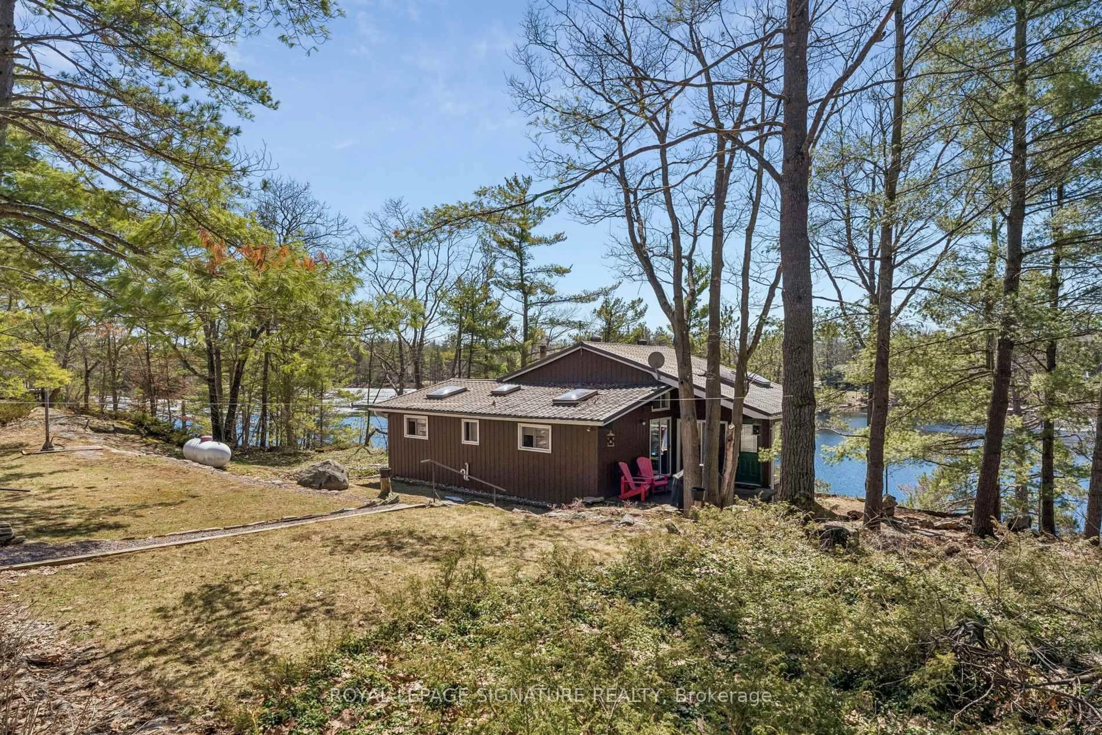 A pic from outside/outdoor area/front of a property/back of a property/a pic from drone, water/lake/river/ocean view for 18 Loon Lake Rd, Gravenhurst Ontario P1P 1R2