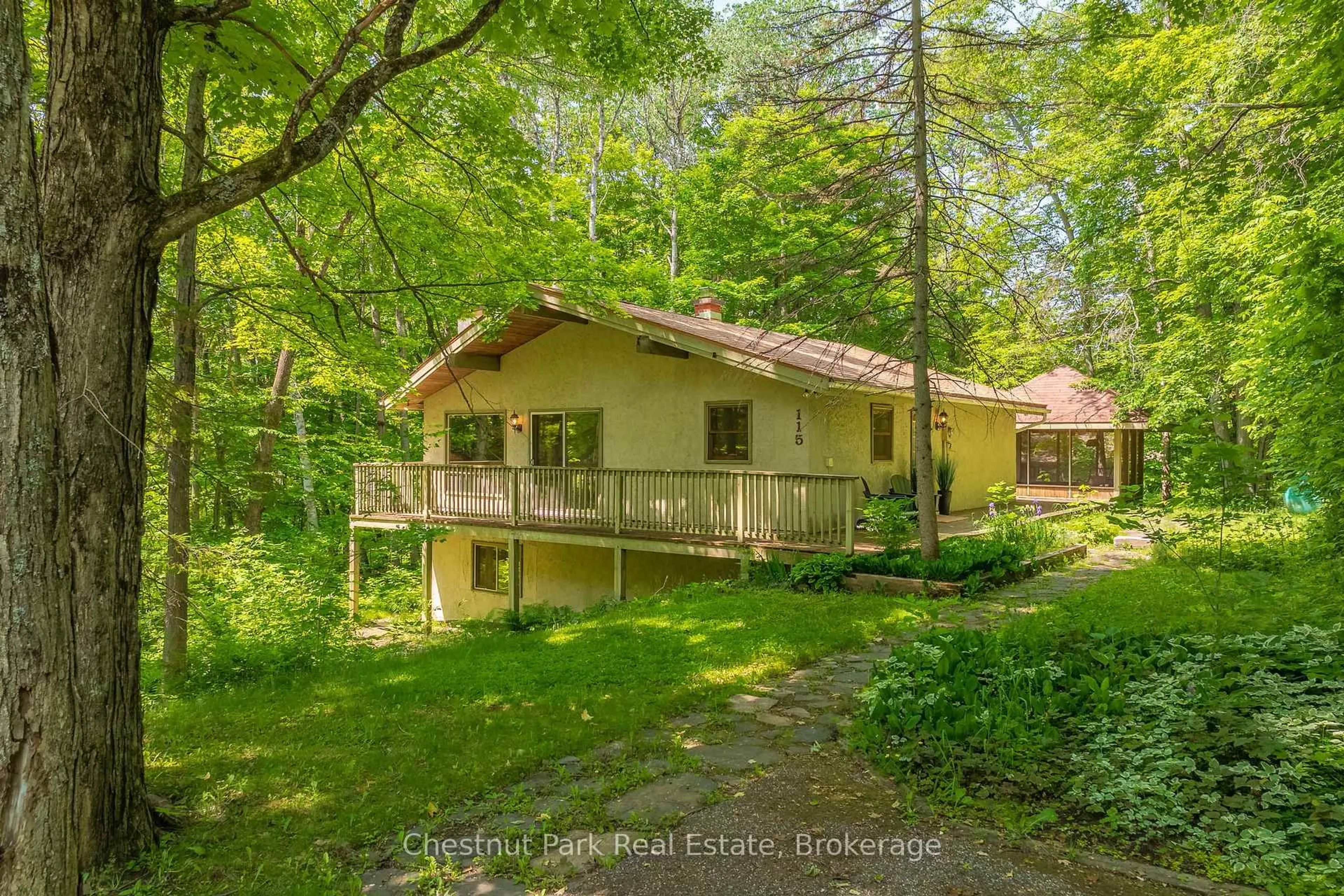 A pic from outside/outdoor area/front of a property/back of a property/a pic from drone, forest/trees view for 115 Woodland Dr, Huntsville Ontario P1H 1A7