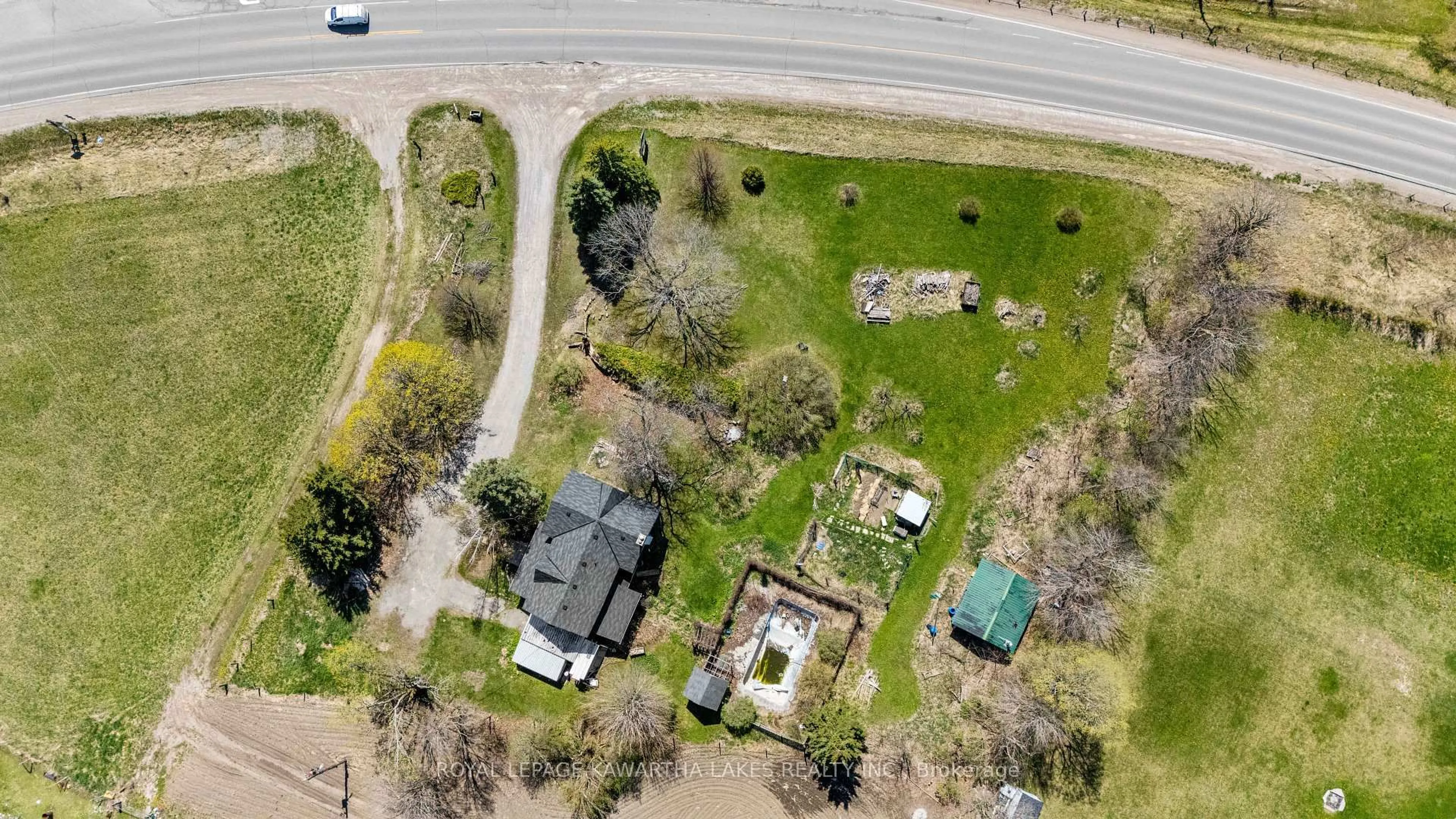 A pic from outside/outdoor area/front of a property/back of a property/a pic from drone, street for 589 County Road 8 Rd, Kawartha Lakes Ontario K0M 1N0
