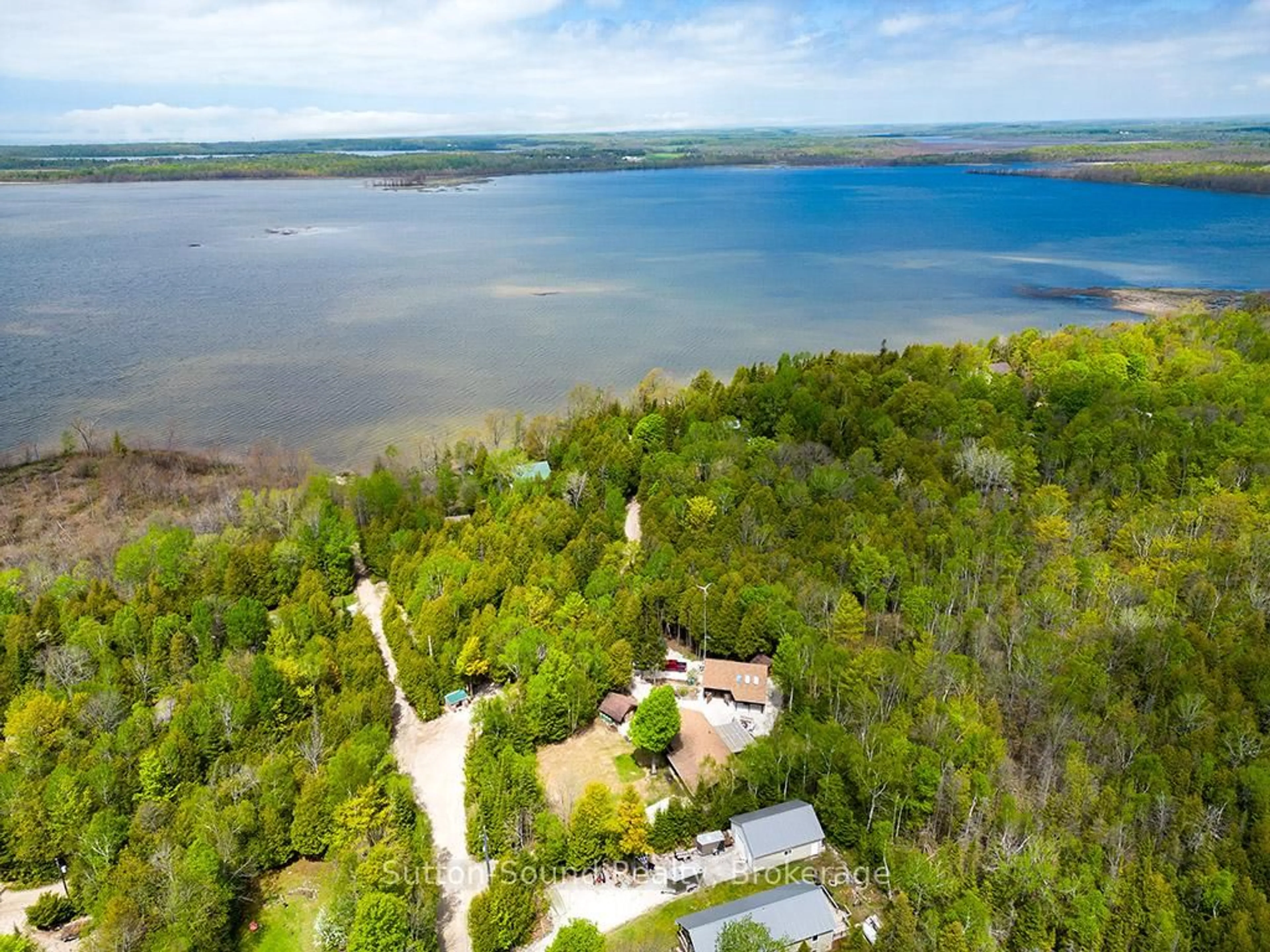 A pic from outside/outdoor area/front of a property/back of a property/a pic from drone, water/lake/river/ocean view for 642 BOAT LAKE Rd, South Bruce Peninsula Ontario N0H 2T0