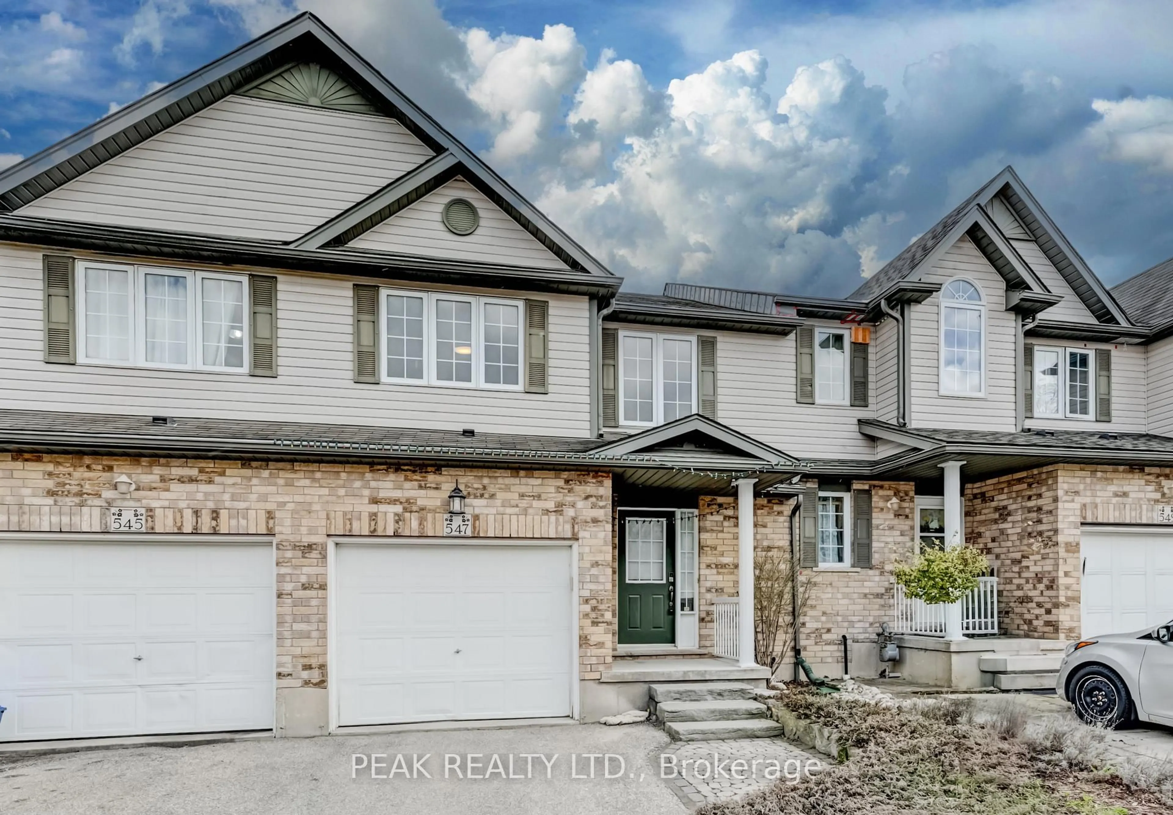 Home with brick exterior material, street for 547 WILD IRIS Ave, Waterloo Ontario N2V 2W4