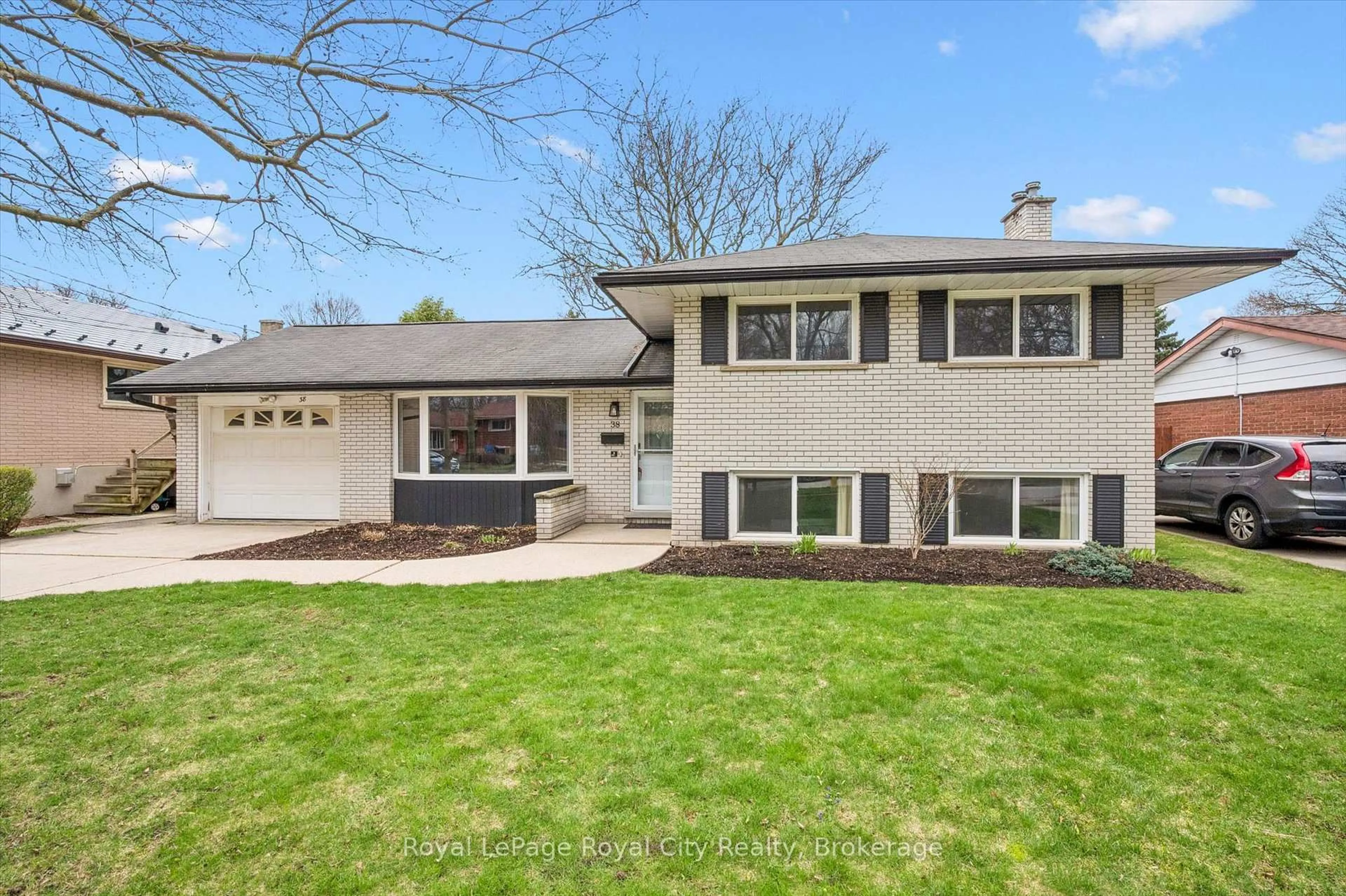 Home with vinyl exterior material, street for 38 Brentwood Dr, Guelph Ontario N1H 5M7