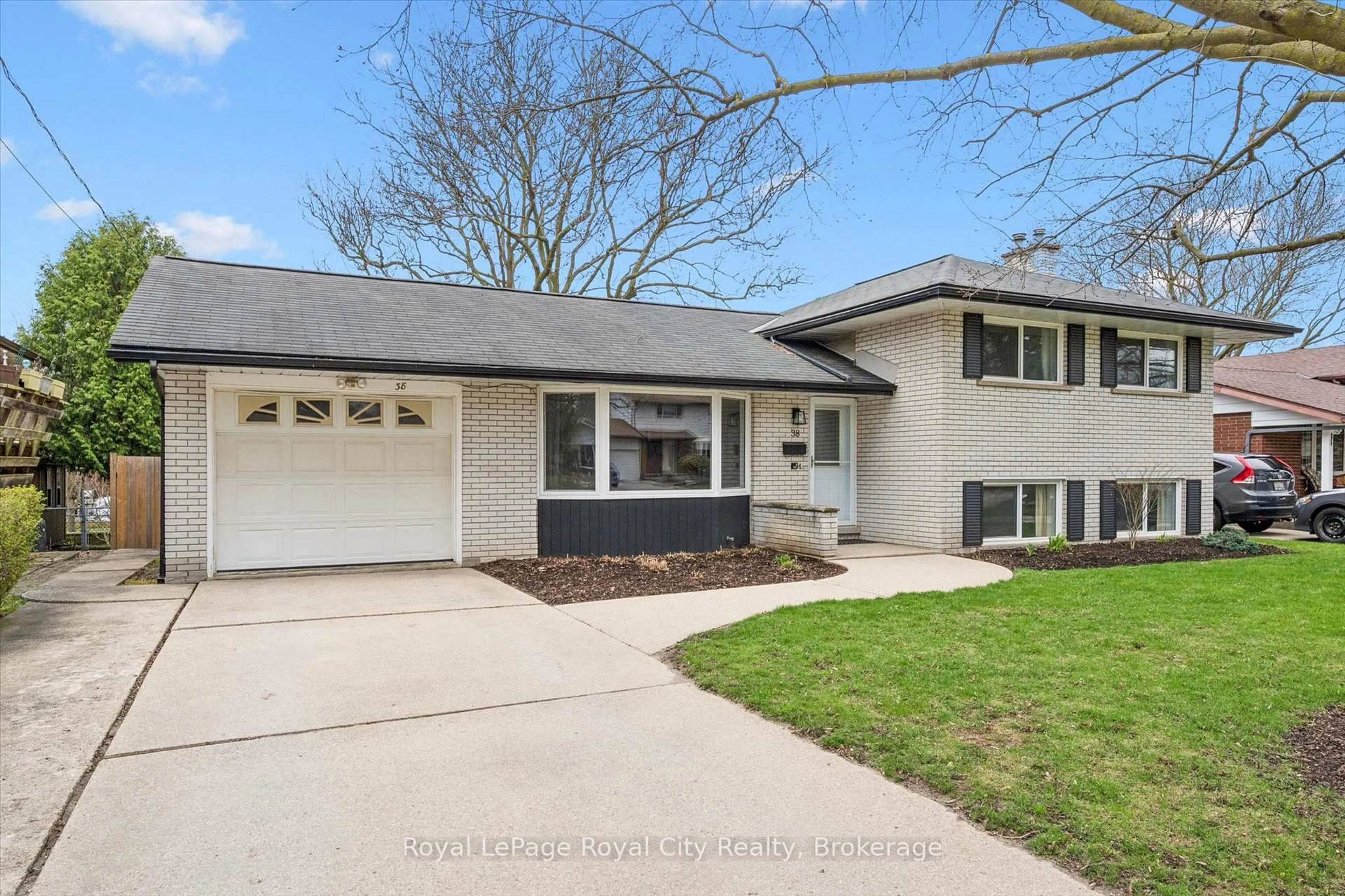 Home with vinyl exterior material, street for 38 Brentwood Dr, Guelph Ontario N1H 5M7