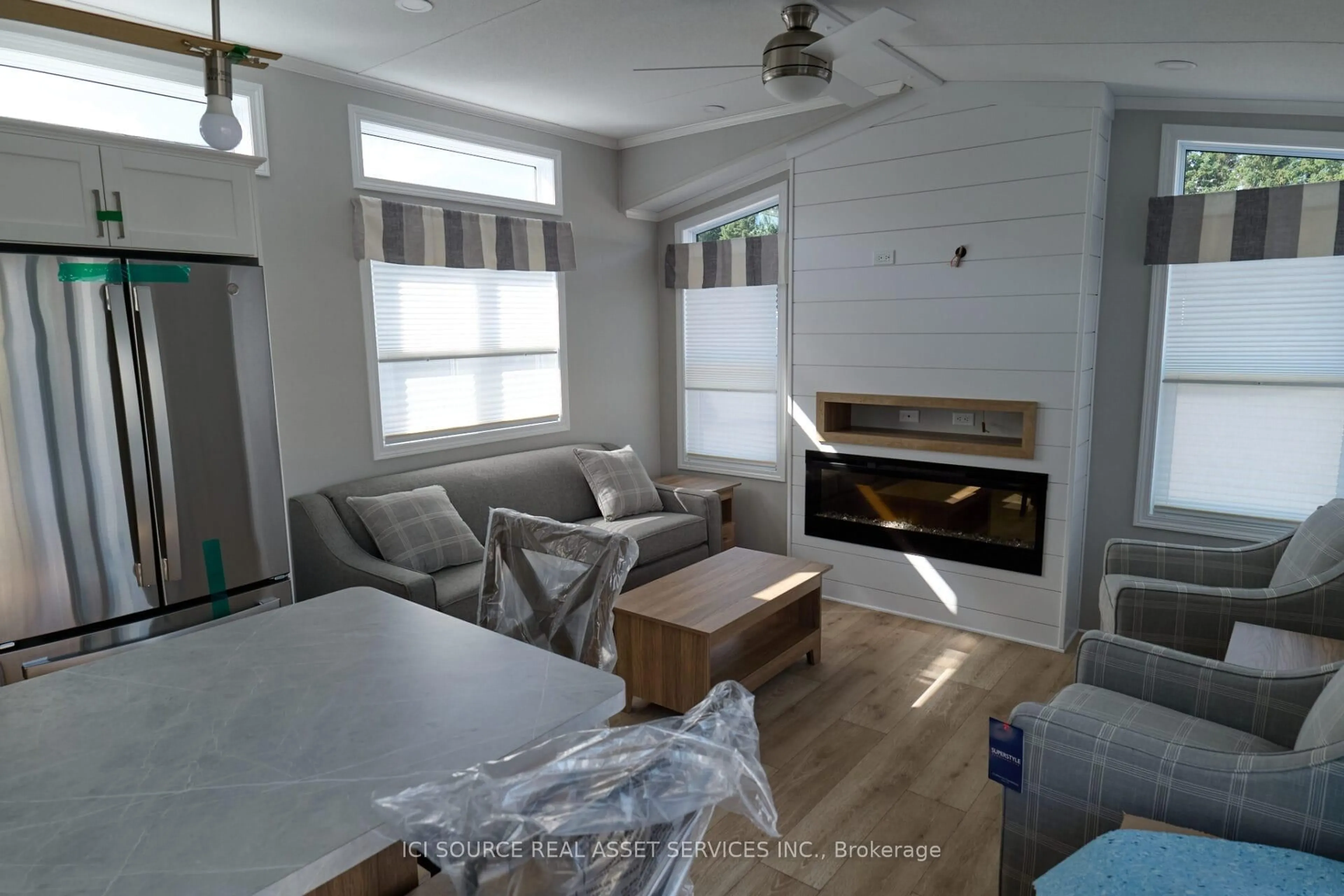 Living room with furniture, wood/laminate floor for 5007 Highway 21 #BEACN, Saugeen Shores Ontario N0H 2C5