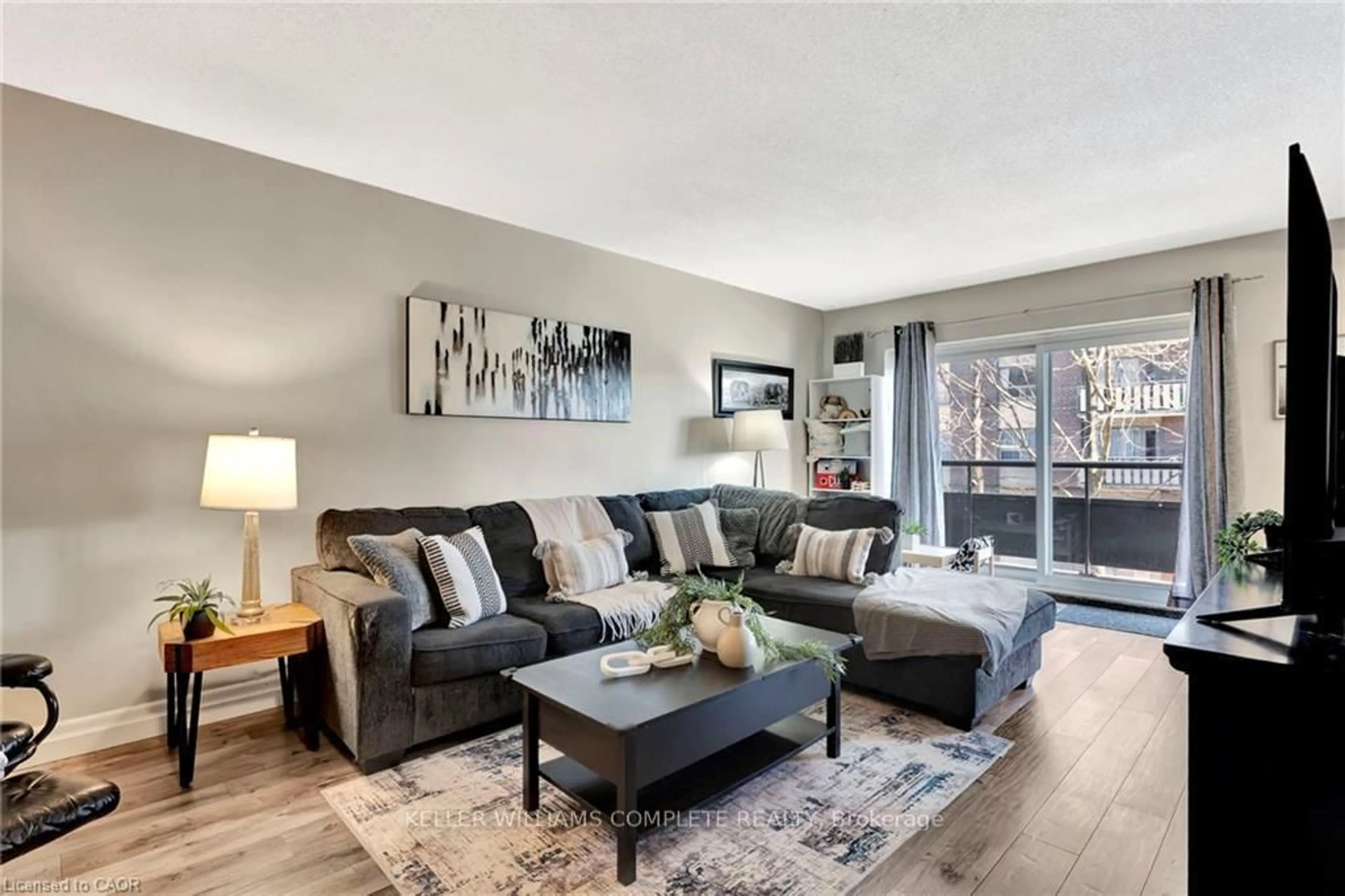 Living room with furniture, unknown for 11 Woodman Dr #307, Hamilton Ontario L8K 4E3