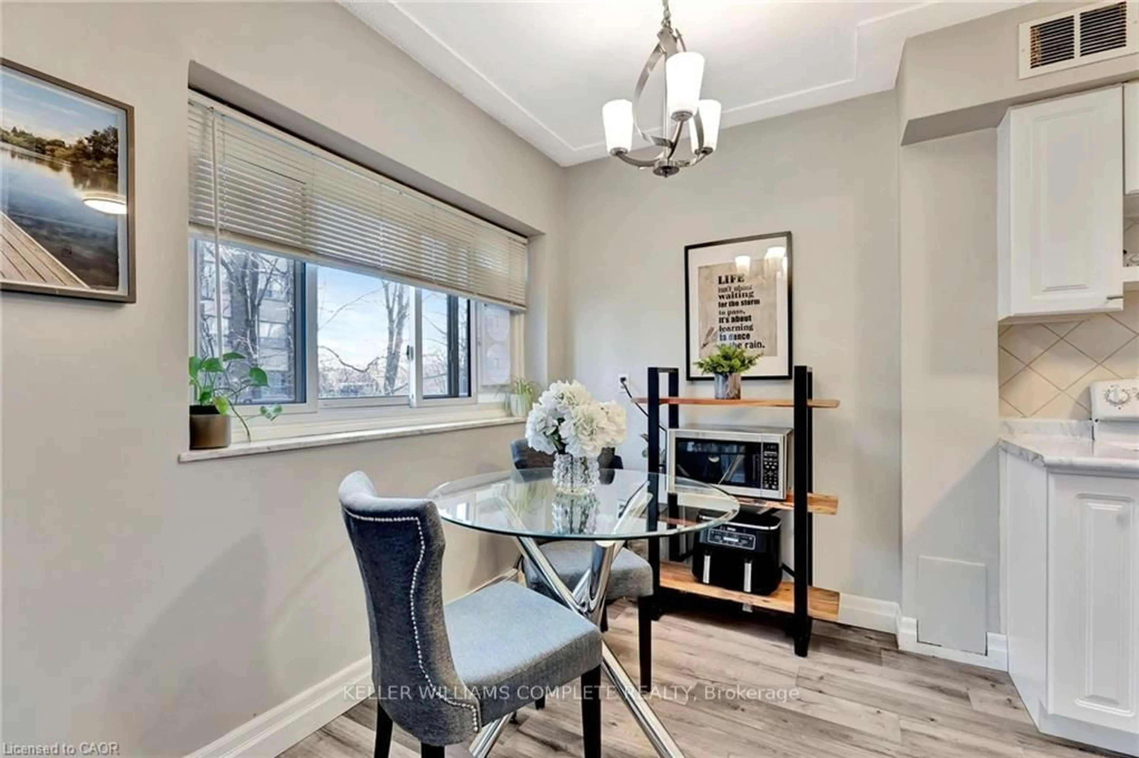 Dining room, wood/laminate floor for 11 Woodman Dr #307, Hamilton Ontario L8K 4E3
