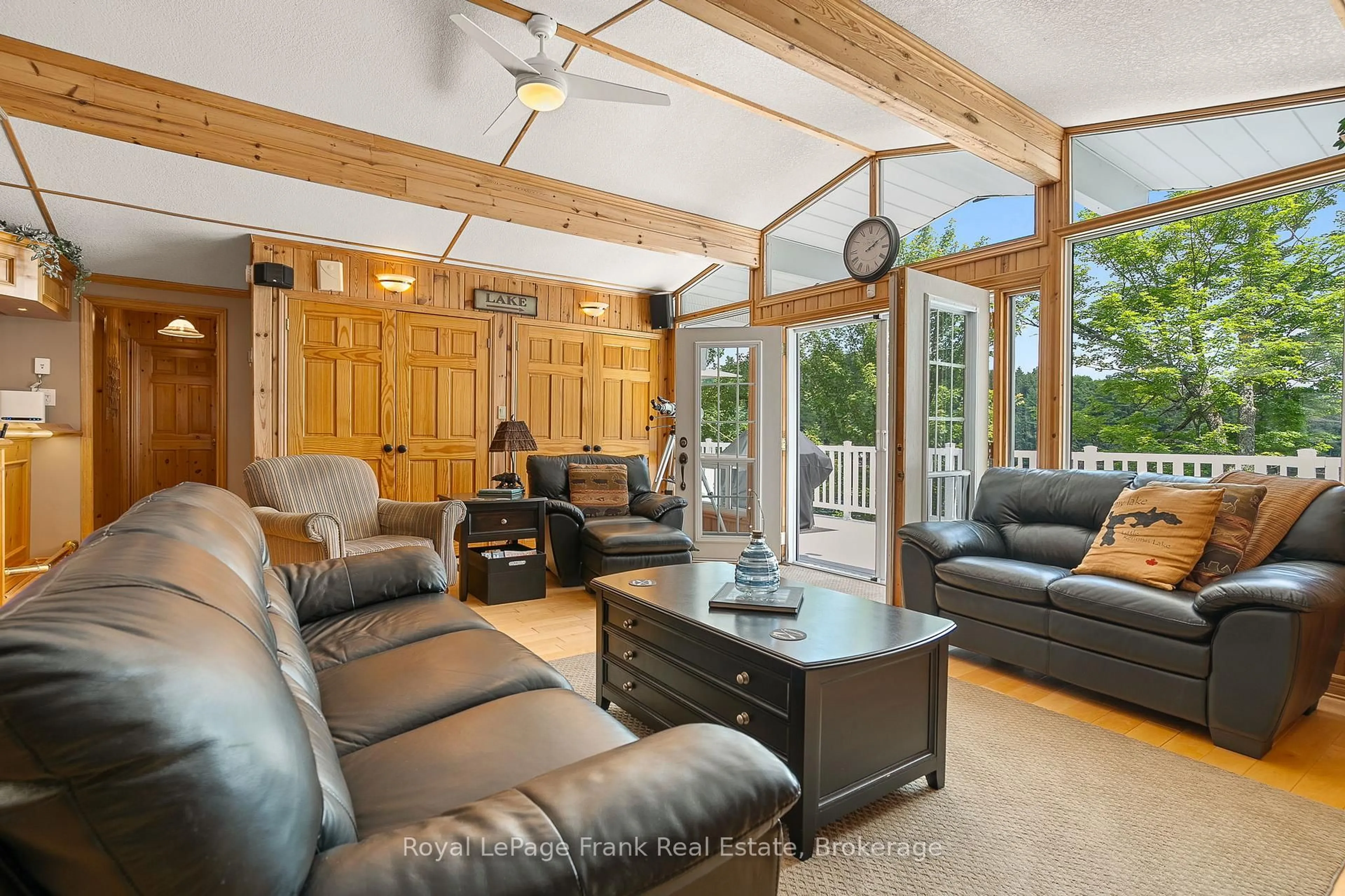 Living room with furniture, wood/laminate floor for 1019 Carnation Lane, Dysart et al Ontario K0M 1S0