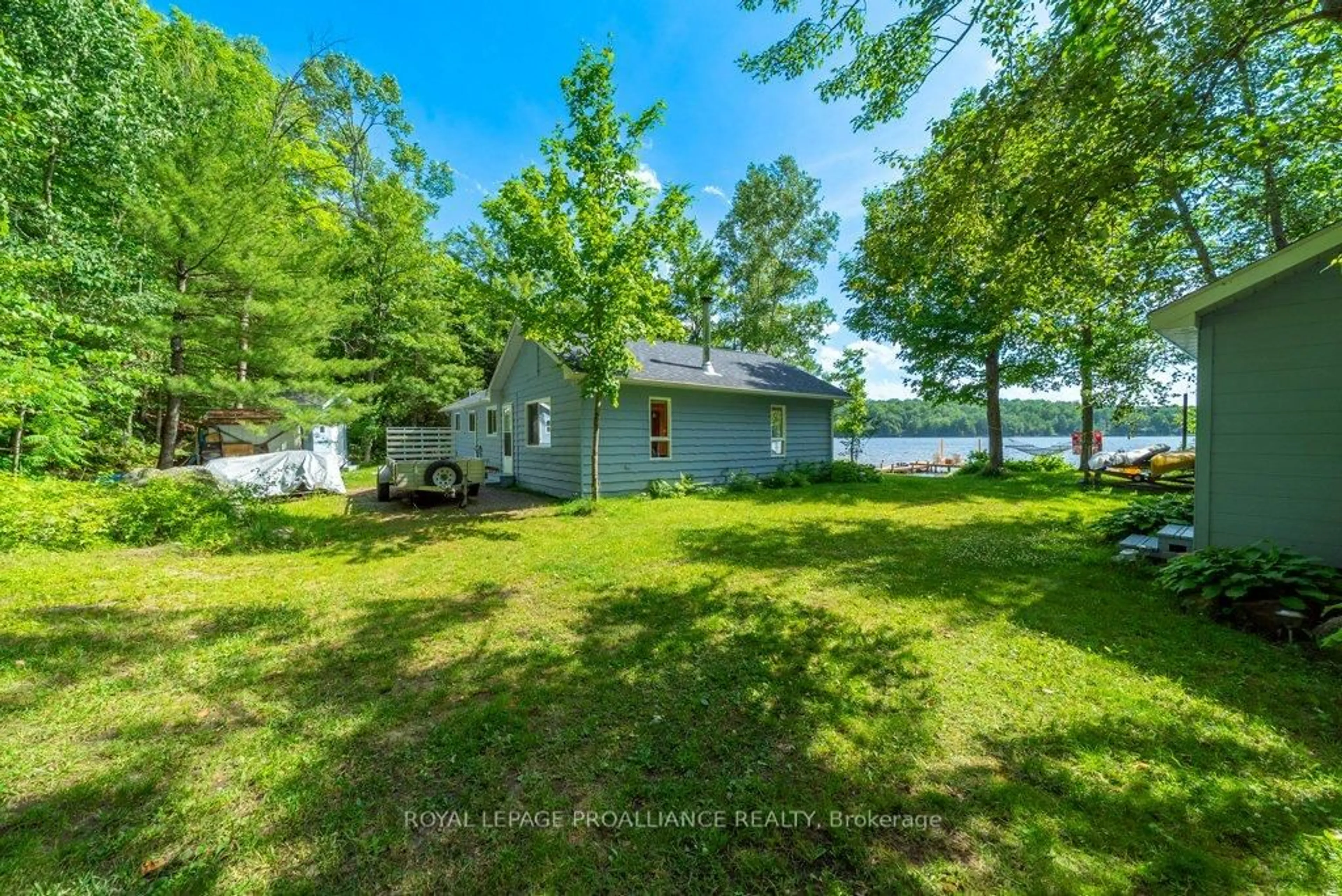 A pic from outside/outdoor area/front of a property/back of a property/a pic from drone, water/lake/river/ocean view for 1937A East Bay Rd, Plevna Ontario K0H 2M0