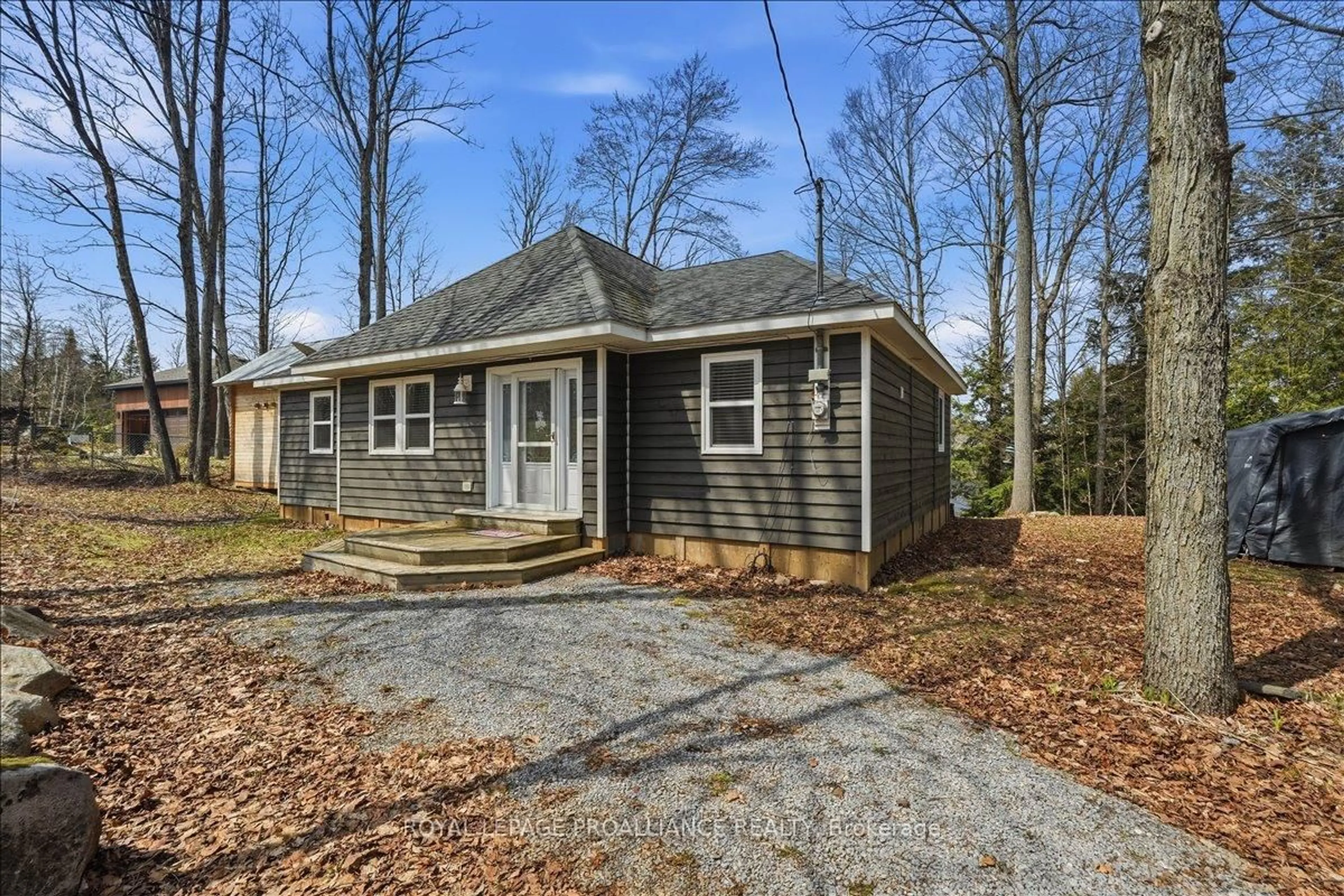 Home with vinyl exterior material, street for 1068 Pleasant Hill Lane, Arden Ontario K0H 1B0