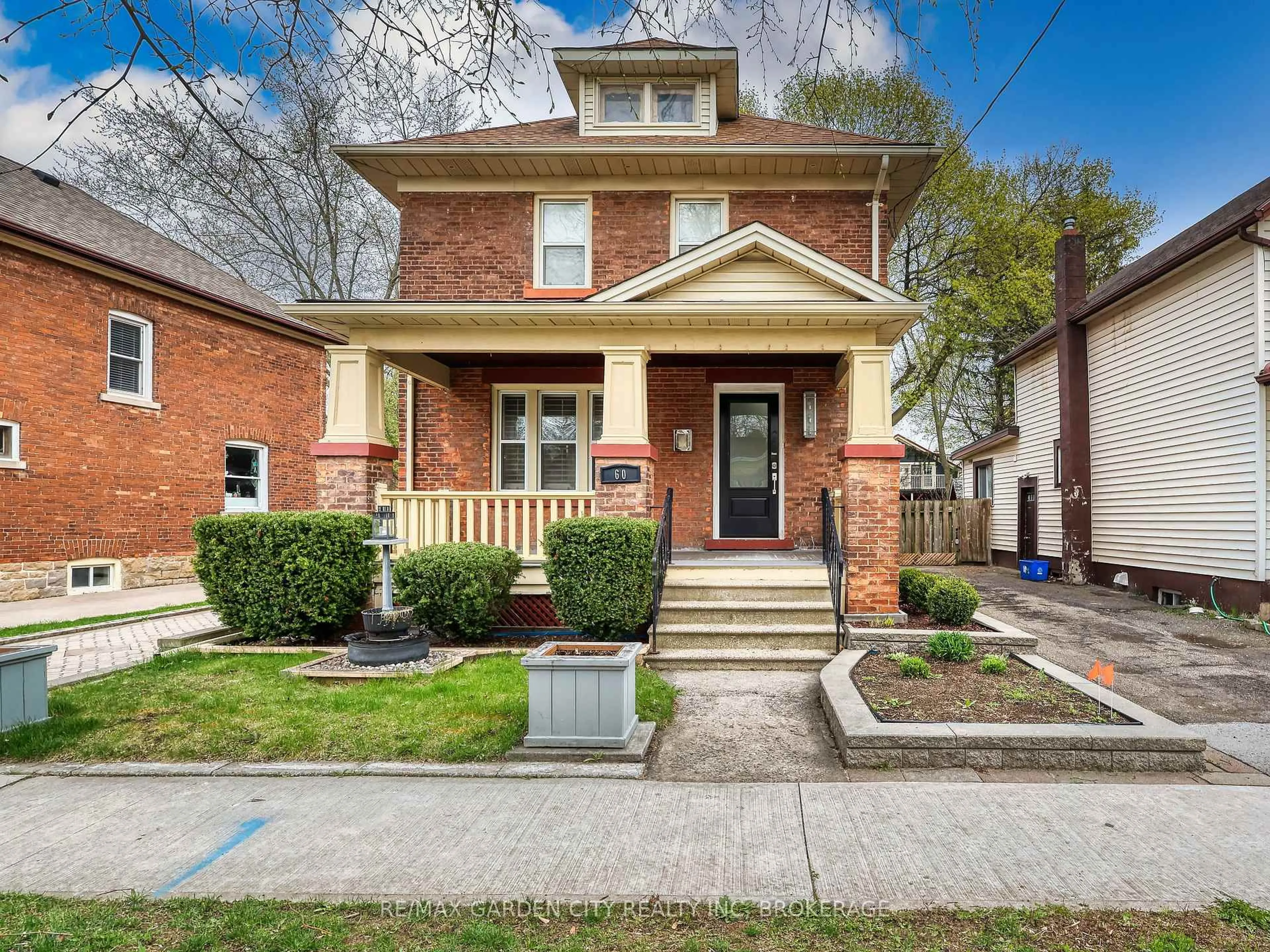 Home with brick exterior material, street for 60 Woodland Ave, St. Catharines Ontario L2R 5A3