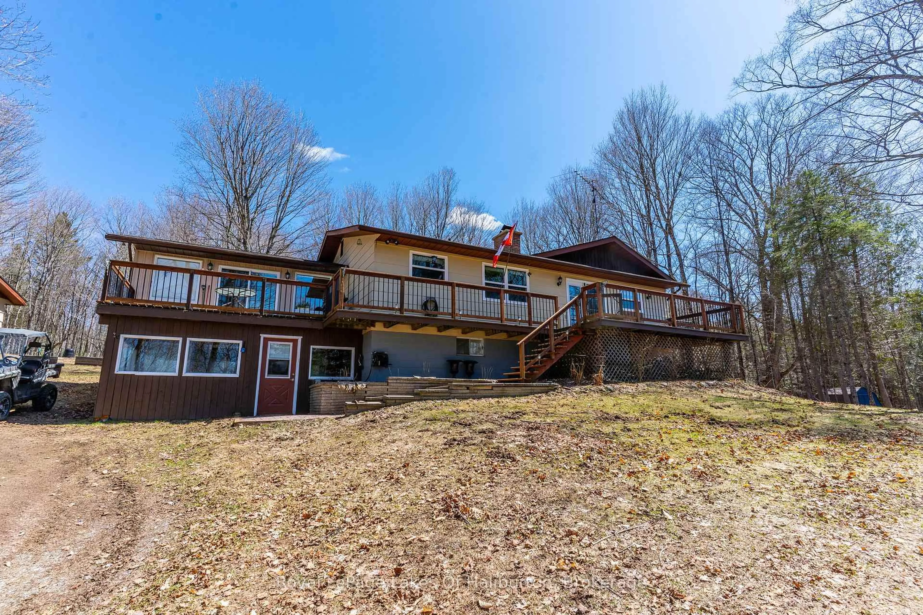 A pic from outside/outdoor area/front of a property/back of a property/a pic from drone, water/lake/river/ocean view for 1096 Chelsea Lane, Algonquin Highlands Ontario K0M 1S0