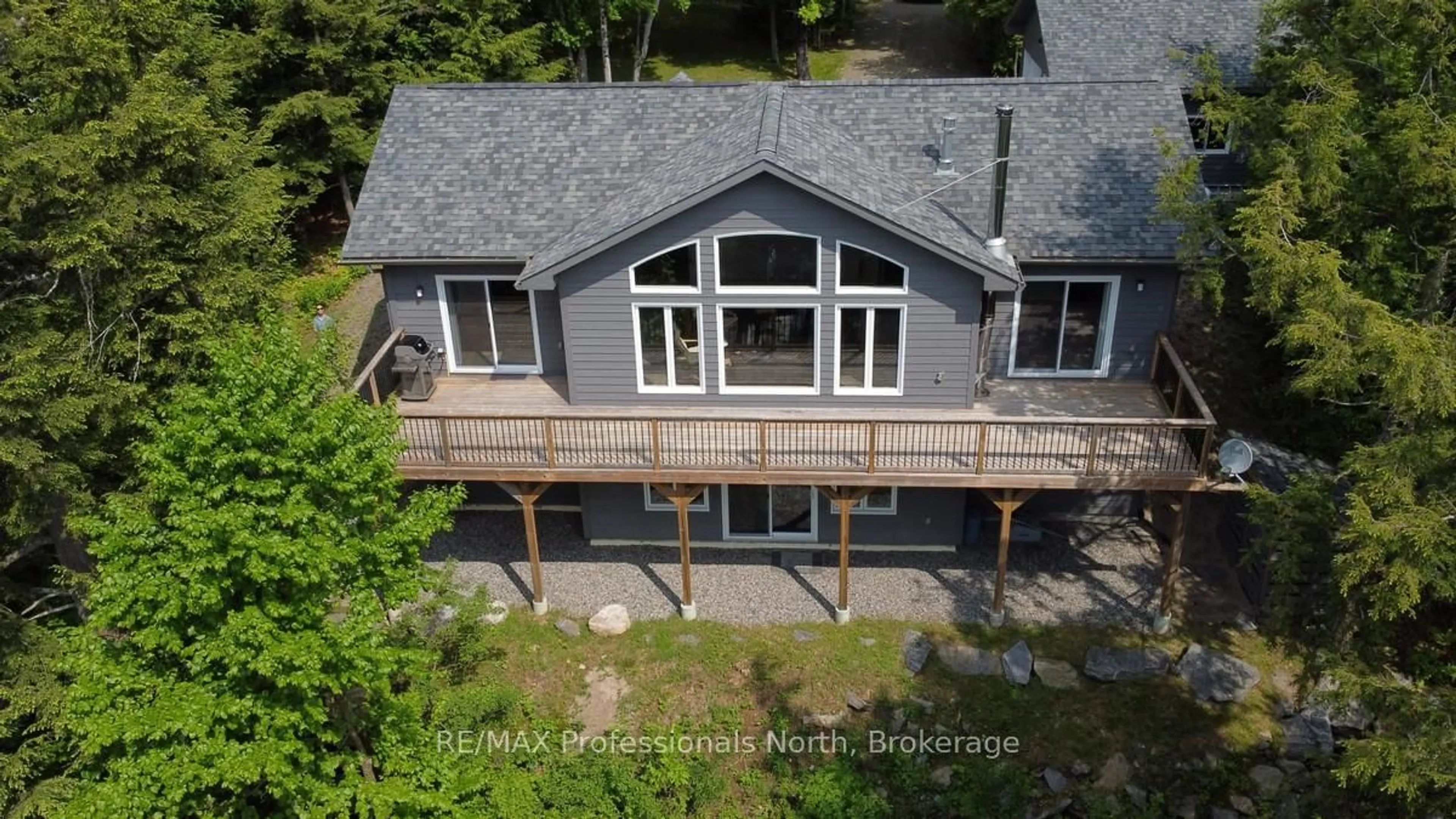 A pic from outside/outdoor area/front of a property/back of a property/a pic from drone, water/lake/river/ocean view for 5997 Kennisis Lake Rd, Dysart et al Ontario K0M 1S0