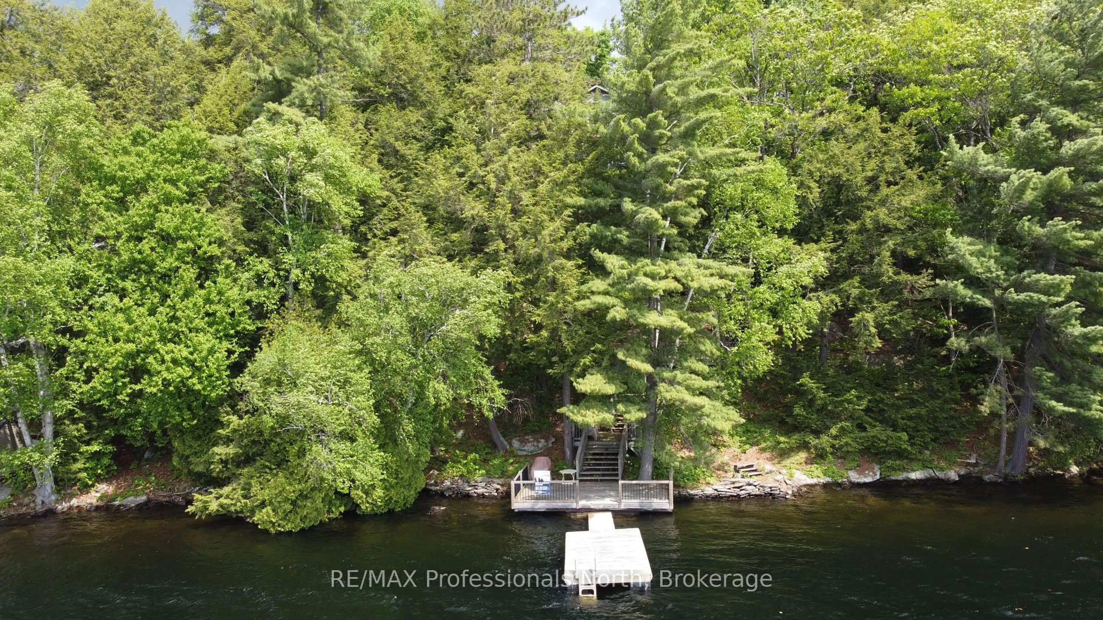 A pic from outside/outdoor area/front of a property/back of a property/a pic from drone, water/lake/river/ocean view for 5997 Kennisis Lake Rd, Dysart et al Ontario K0M 1S0