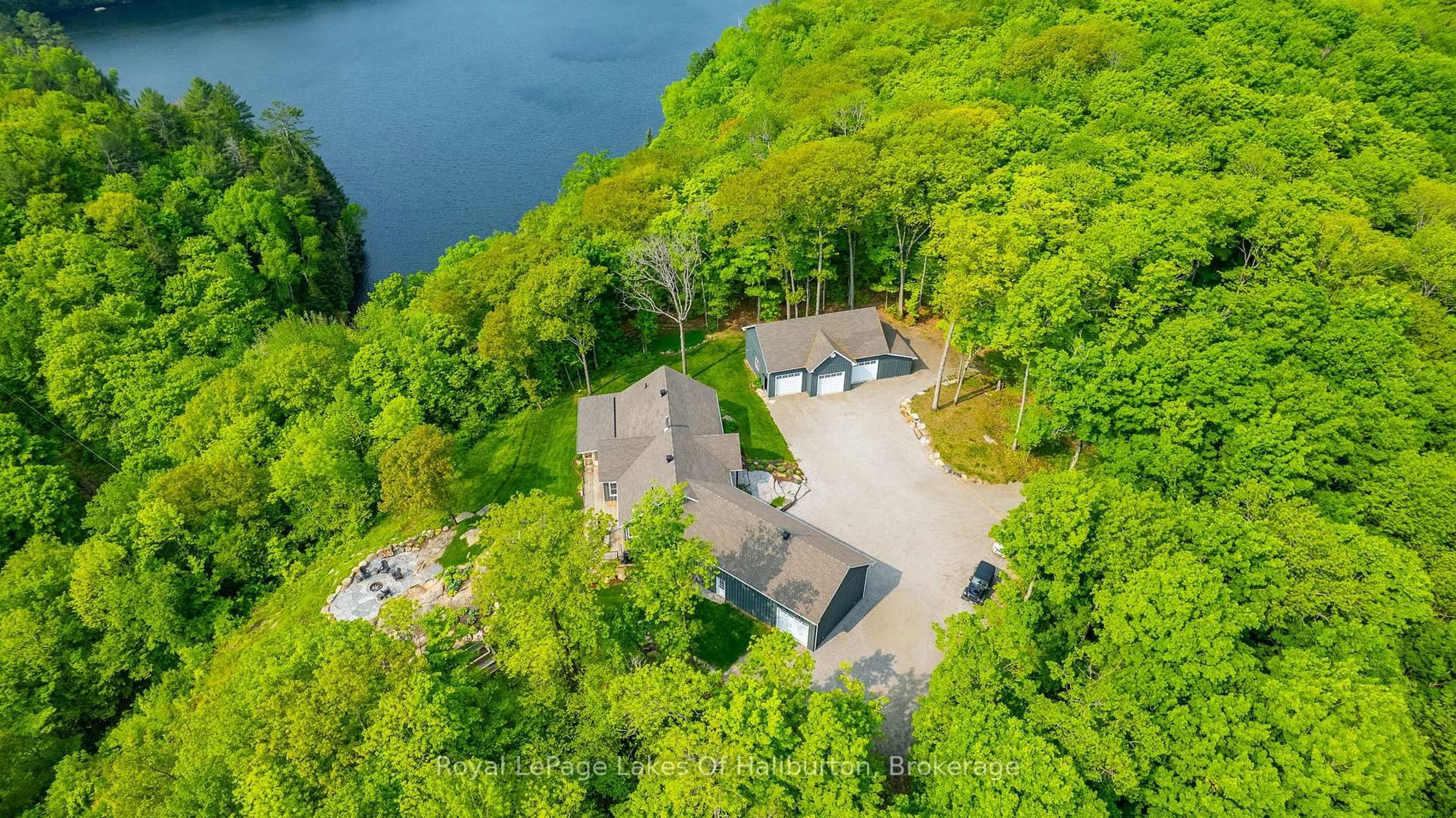 A pic from outside/outdoor area/front of a property/back of a property/a pic from drone, water/lake/river/ocean view for 1143 Trillium Tr, Dysart et al Ontario K0M 1S0