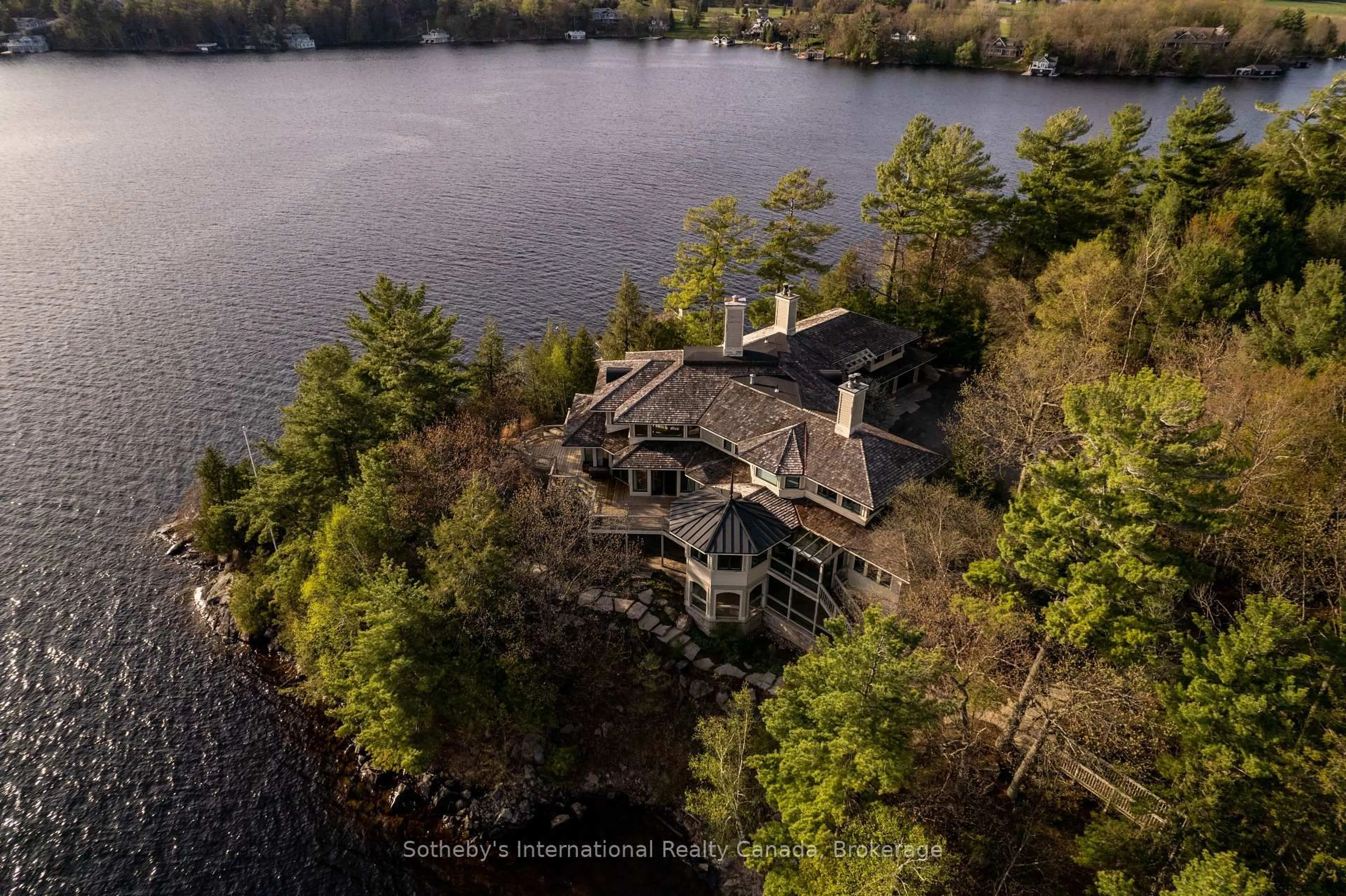 A pic from outside/outdoor area/front of a property/back of a property/a pic from drone, water/lake/river/ocean view for 1250 WALDMERE Rd #Point Cottage, Bracebridge Ontario P1L 1W8