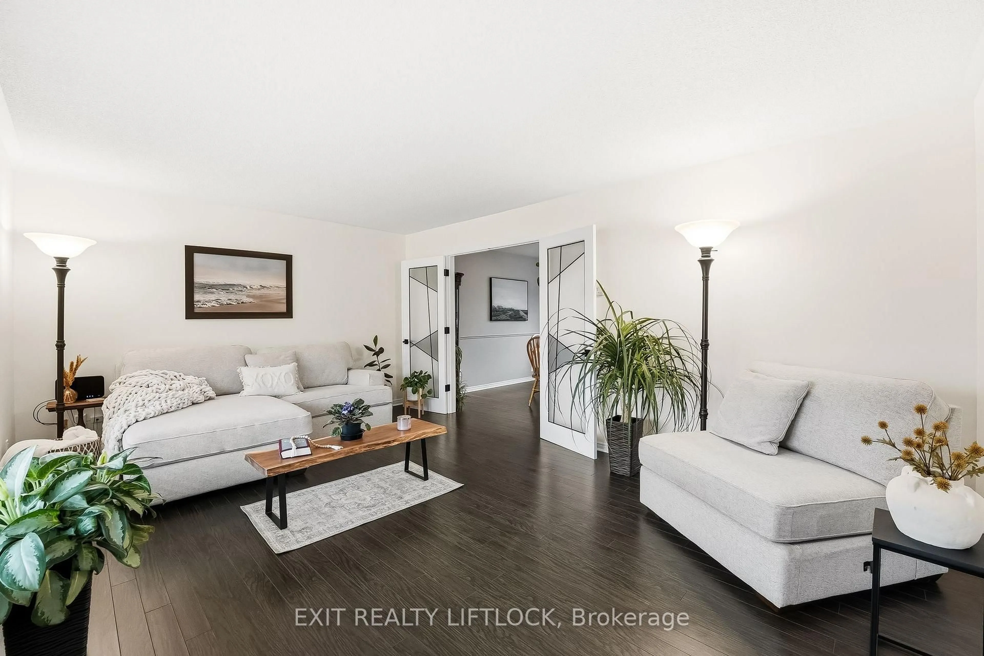 Living room with furniture, wood/laminate floor for 2285 Lynhaven Rd, Peterborough Ontario K9K 1V5