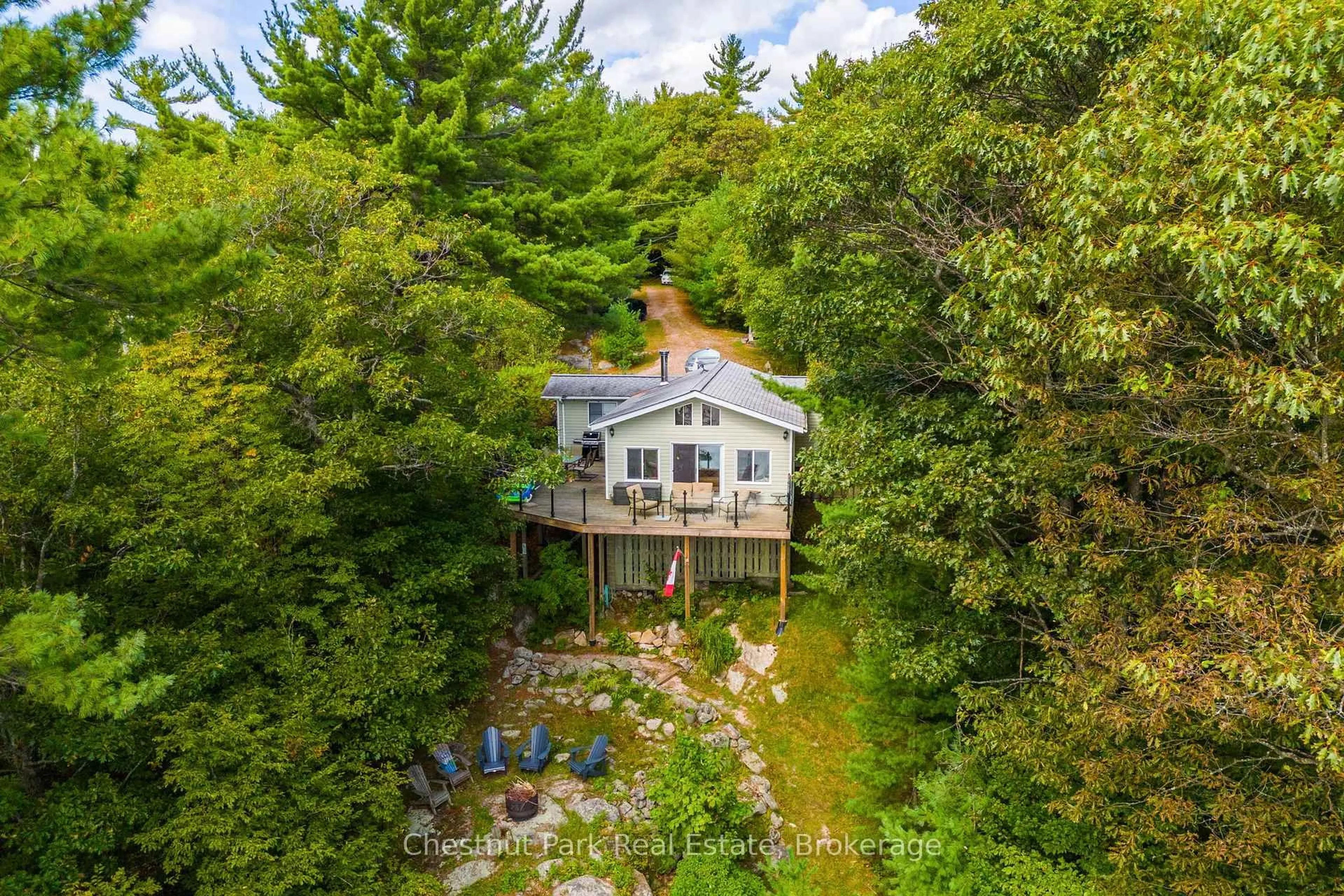 A pic from outside/outdoor area/front of a property/back of a property/a pic from drone, water/lake/river/ocean view for 13 Fire Rt # 1 Rd, Carling Ontario P0G 1G0