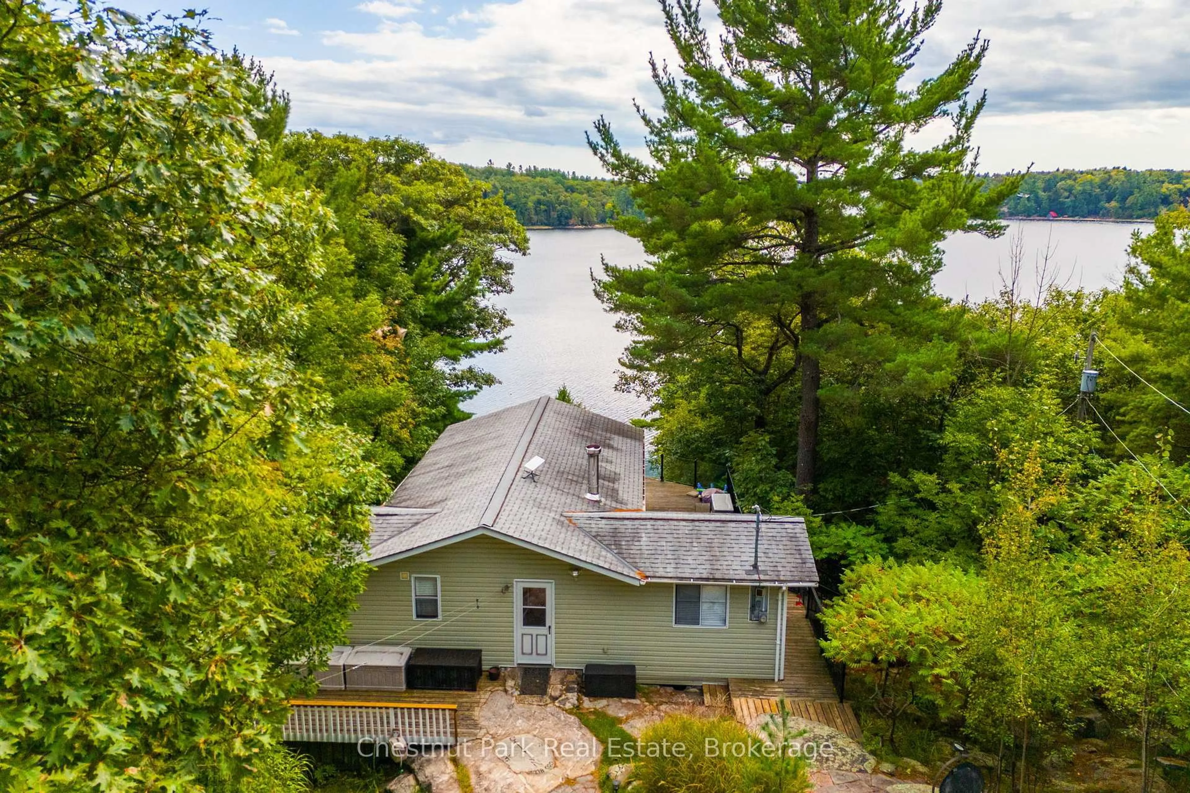 A pic from outside/outdoor area/front of a property/back of a property/a pic from drone, water/lake/river/ocean view for 13 Fire Rt # 1 Rd, Carling Ontario P0G 1G0