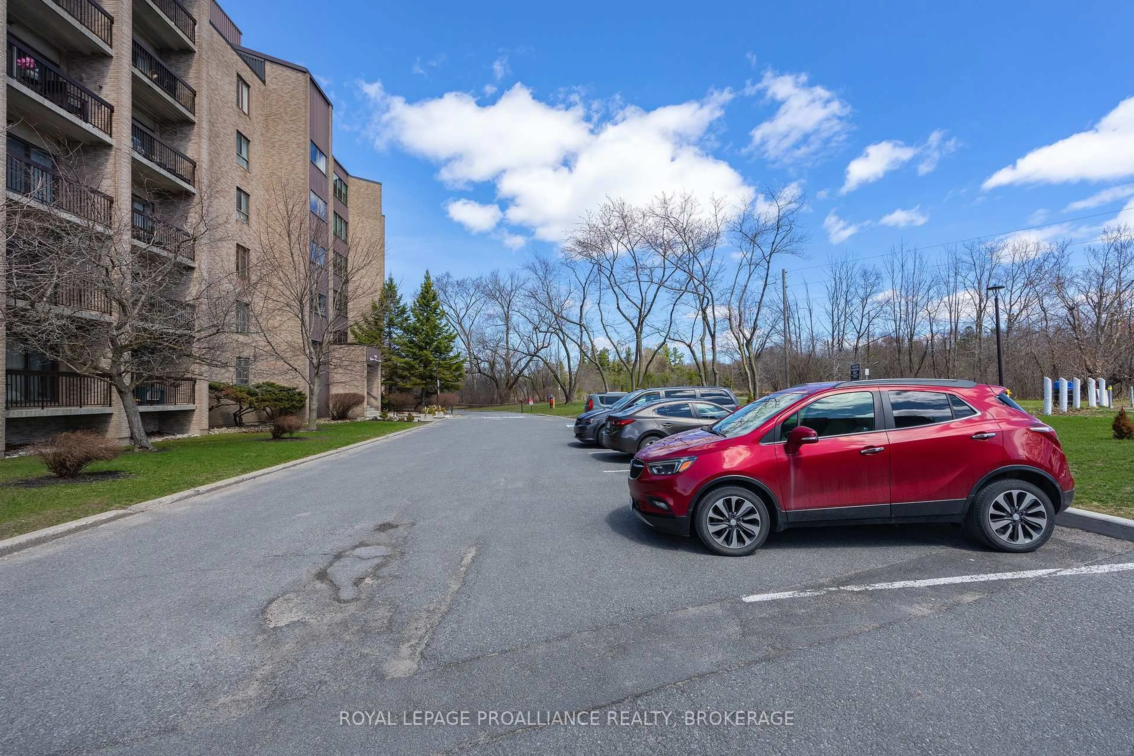 A pic from outside/outdoor area/front of a property/back of a property/a pic from drone, street for 358 Queen Mary Rd #214, Kingston Ontario K7M 7E8