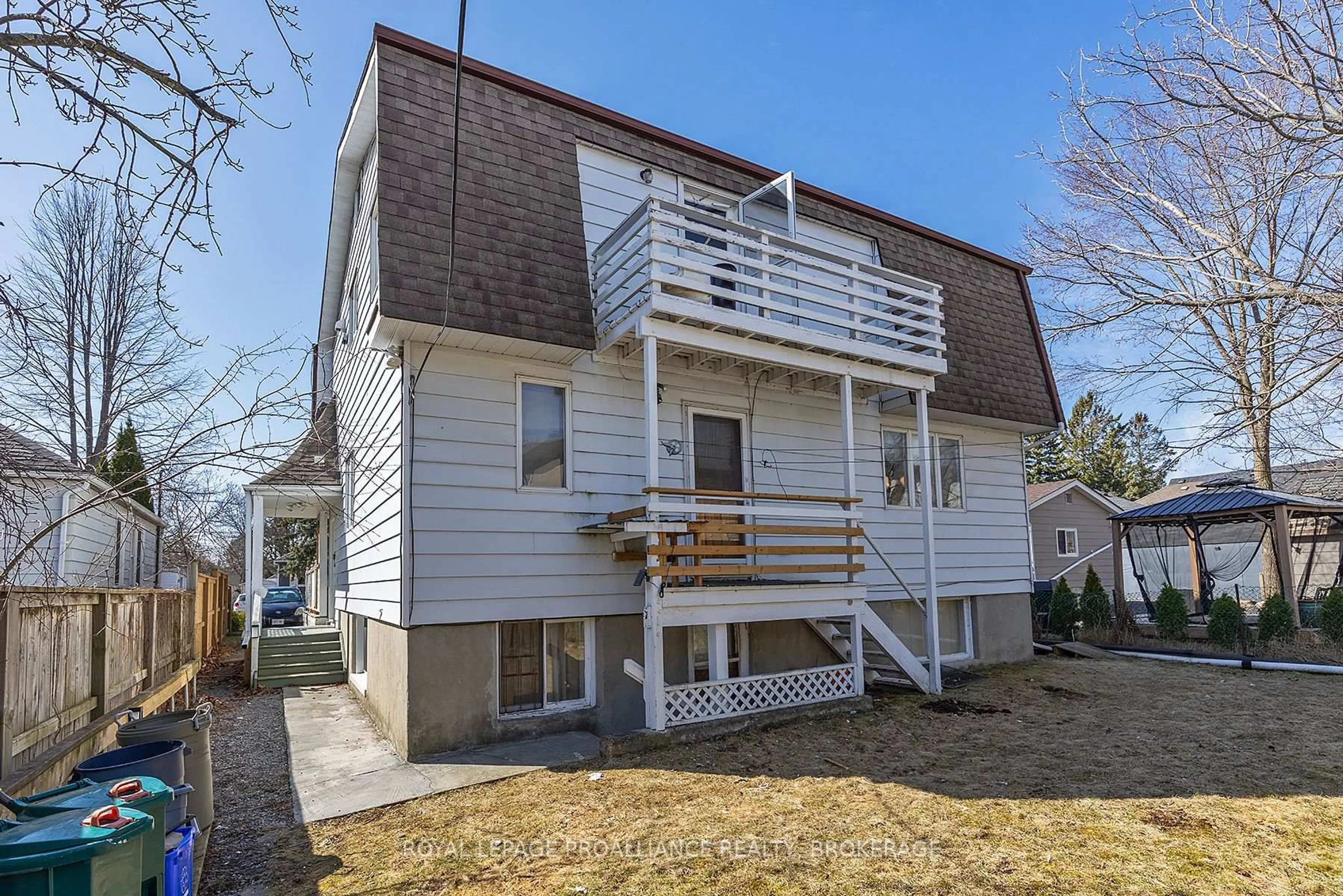 Home with vinyl exterior material, street for 69 Scott St, Kingston Ontario K7L 1L6