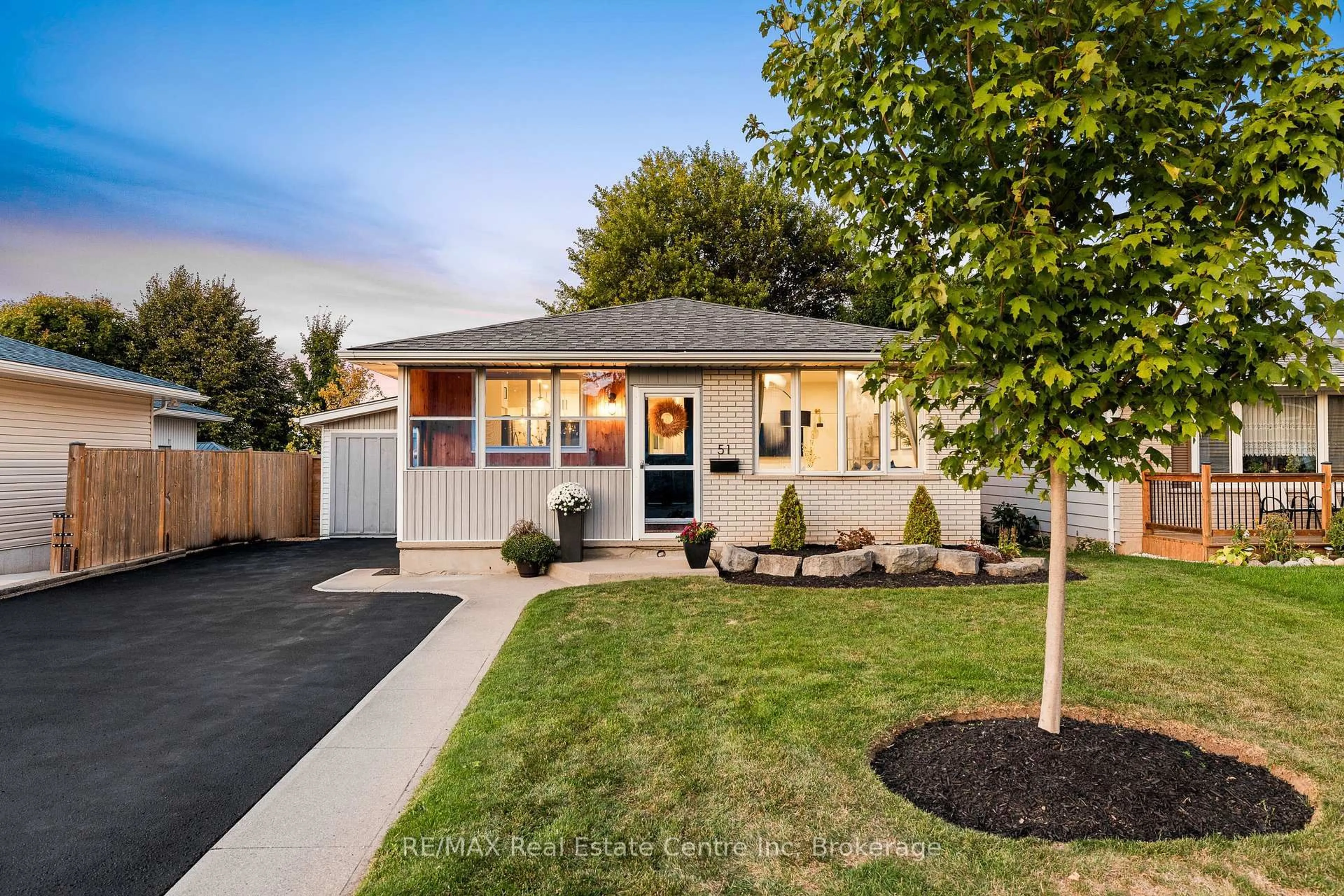 Home with vinyl exterior material, street for 51 Muskoka Dr, Guelph Ontario N1E 3M8