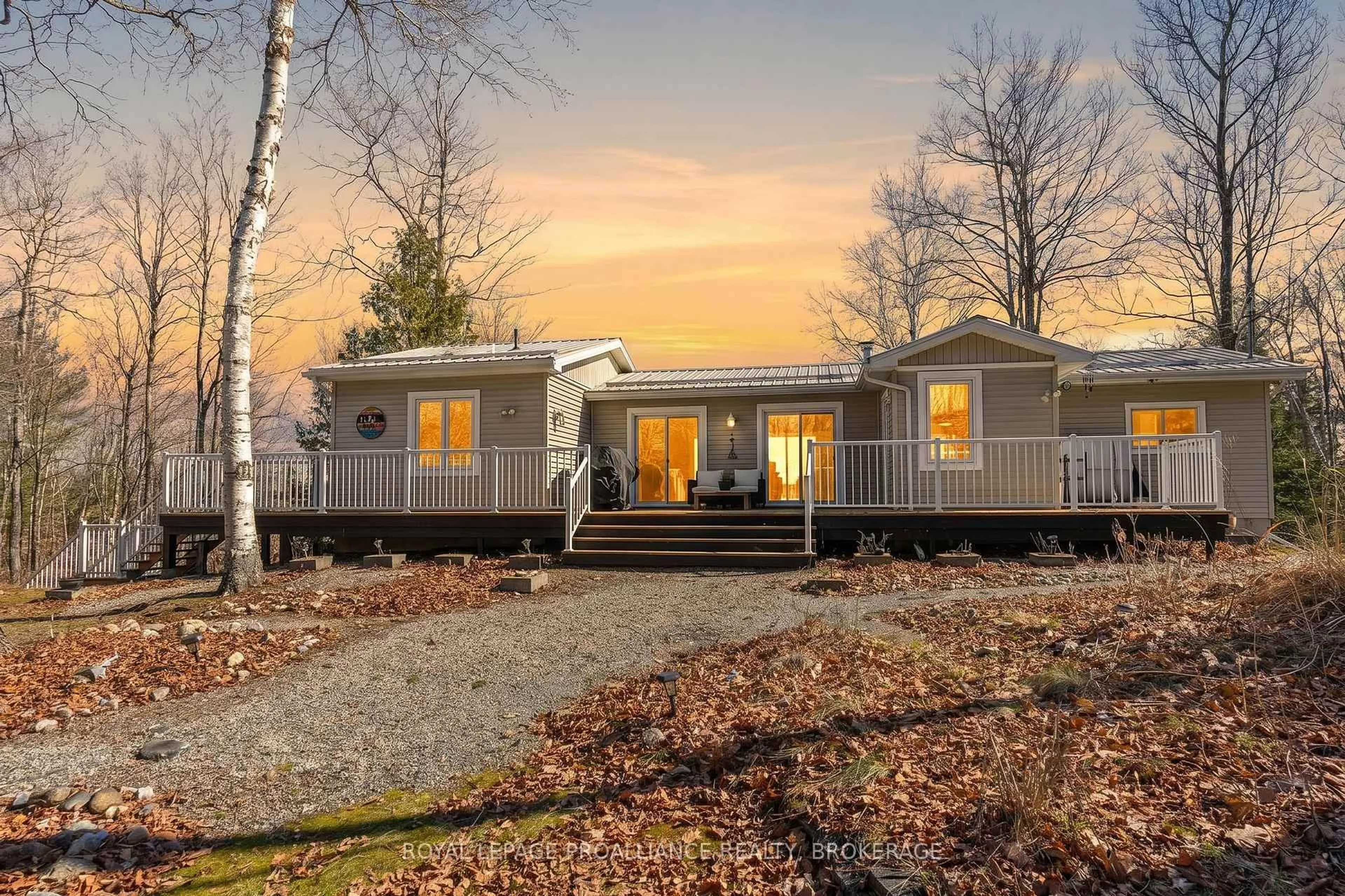 Home with vinyl exterior material, street for 1077 Country Lane, Sharbot Lake Ontario K0H 2P0