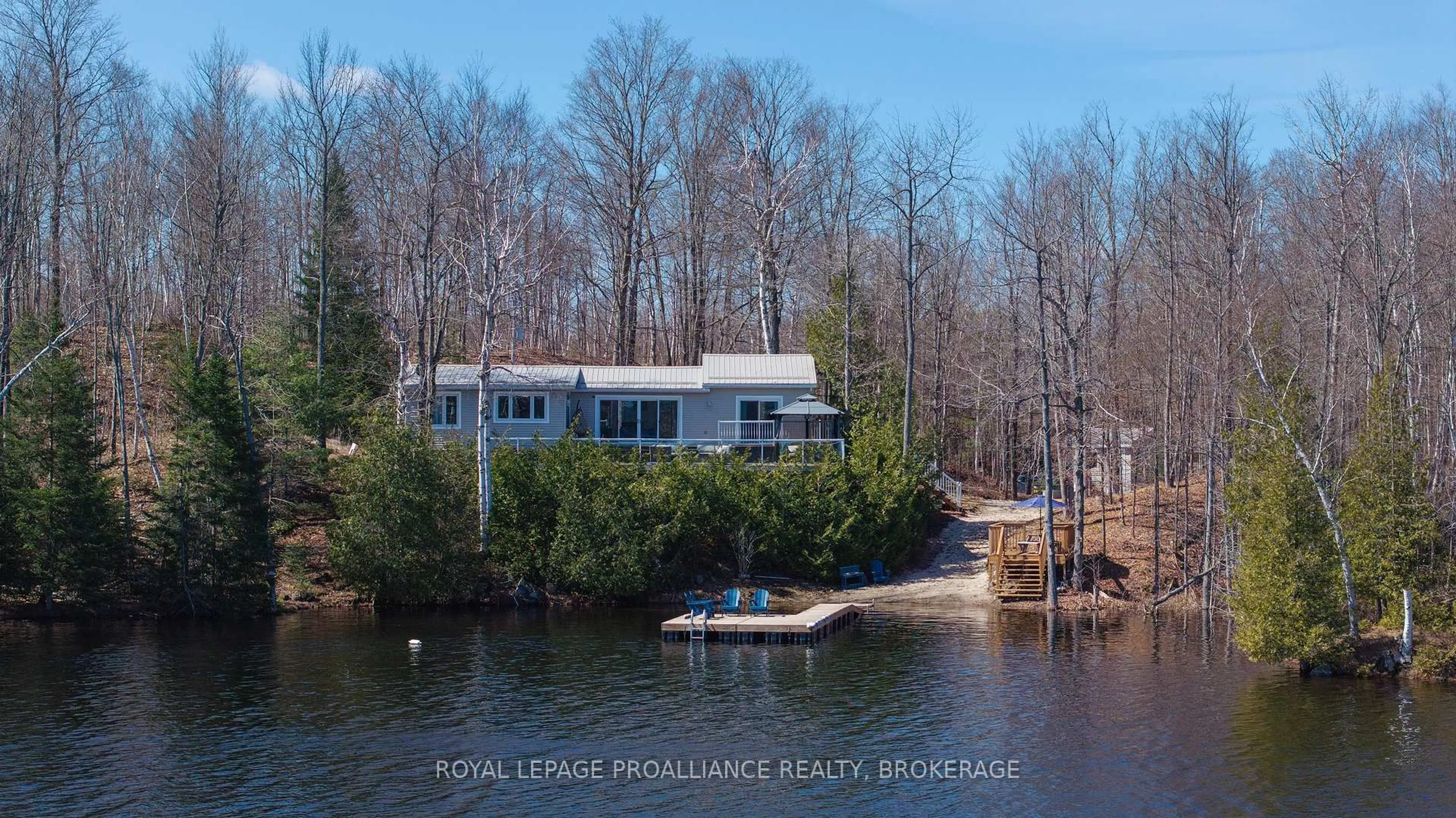 A pic from outside/outdoor area/front of a property/back of a property/a pic from drone, water/lake/river/ocean view for 1077 Country Lane, Sharbot Lake Ontario K0H 2P0