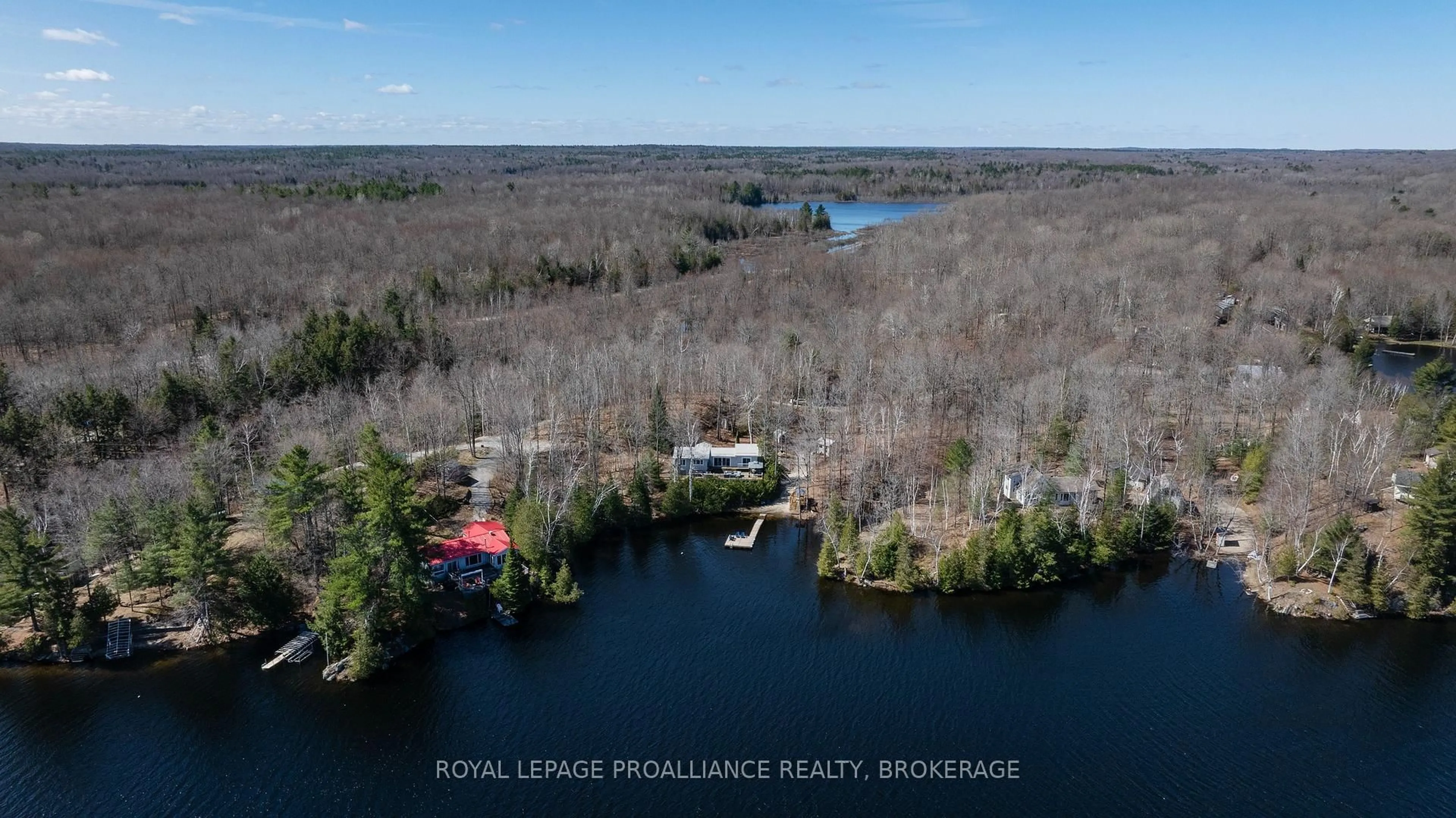 A pic from outside/outdoor area/front of a property/back of a property/a pic from drone, water/lake/river/ocean view for 1077 Country Lane, Sharbot Lake Ontario K0H 2P0