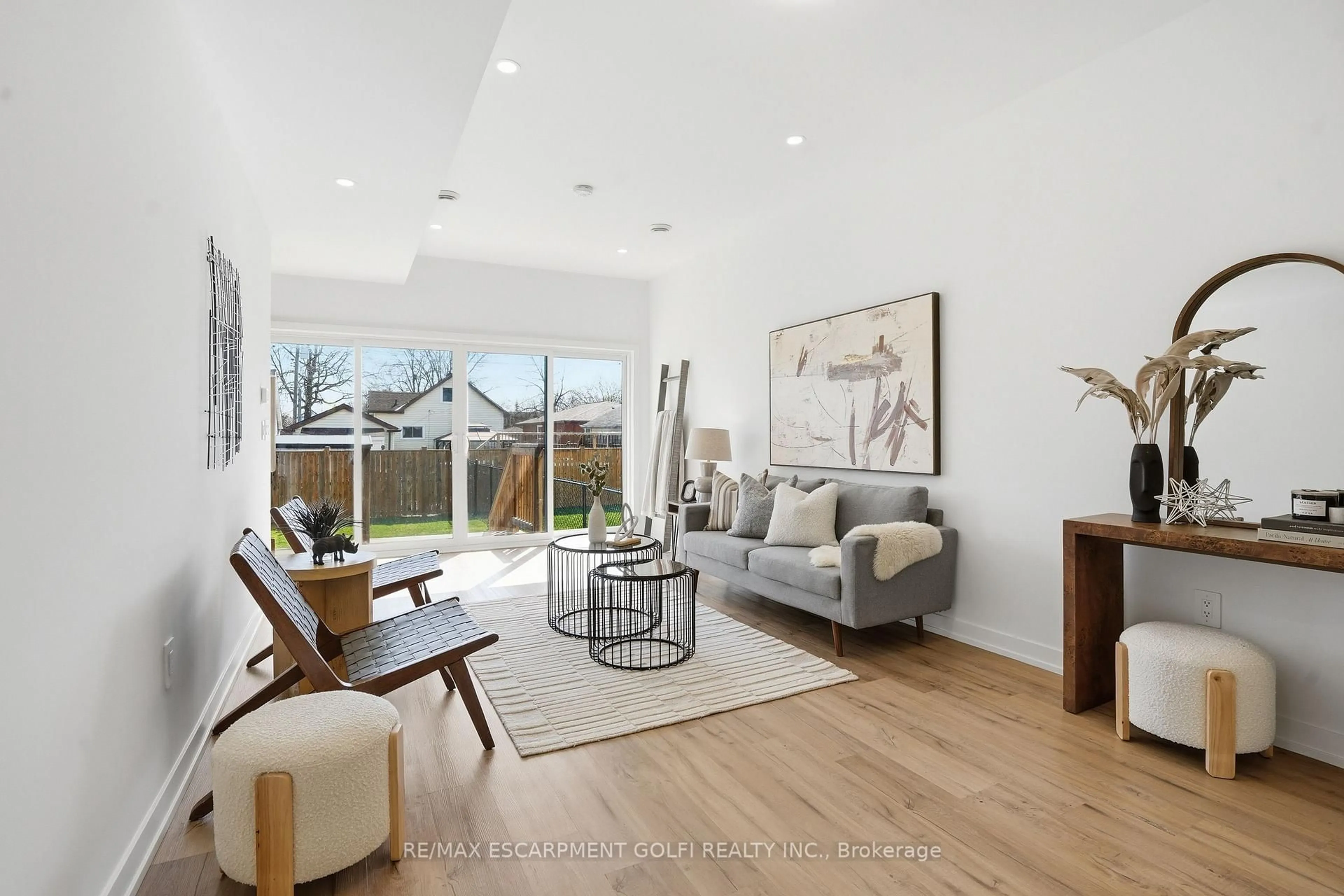 Living room with furniture, wood/laminate floor for 245 Dain Ave, Welland Ontario L3B 3E7