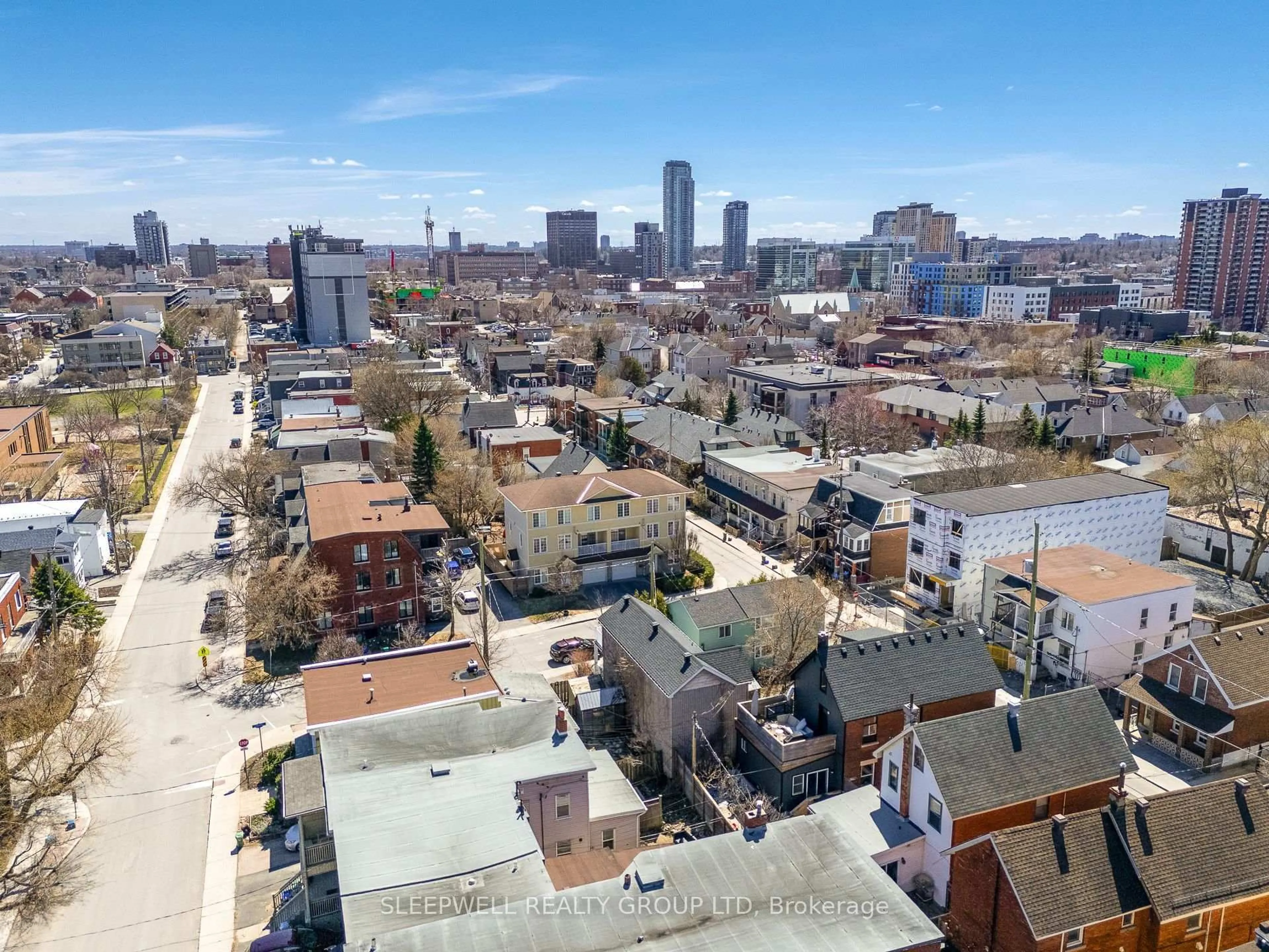 A pic from outside/outdoor area/front of a property/back of a property/a pic from drone, city buildings view from balcony for 54 Christie St, Ottawa Ontario K1R 0A9