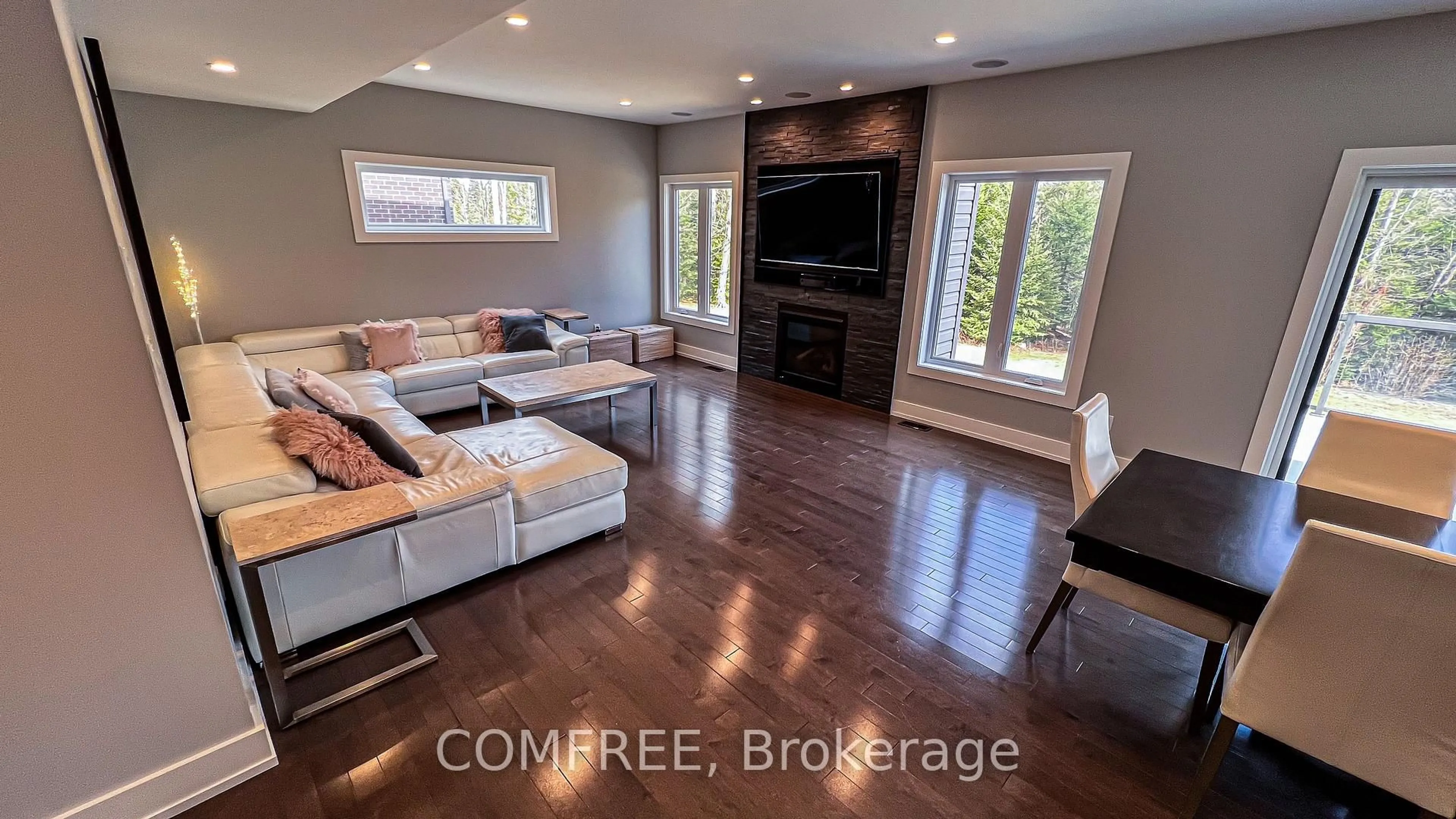 Living room with furniture, wood/laminate floor for 421 Pearce St, North Bay Ontario P1C 1M8