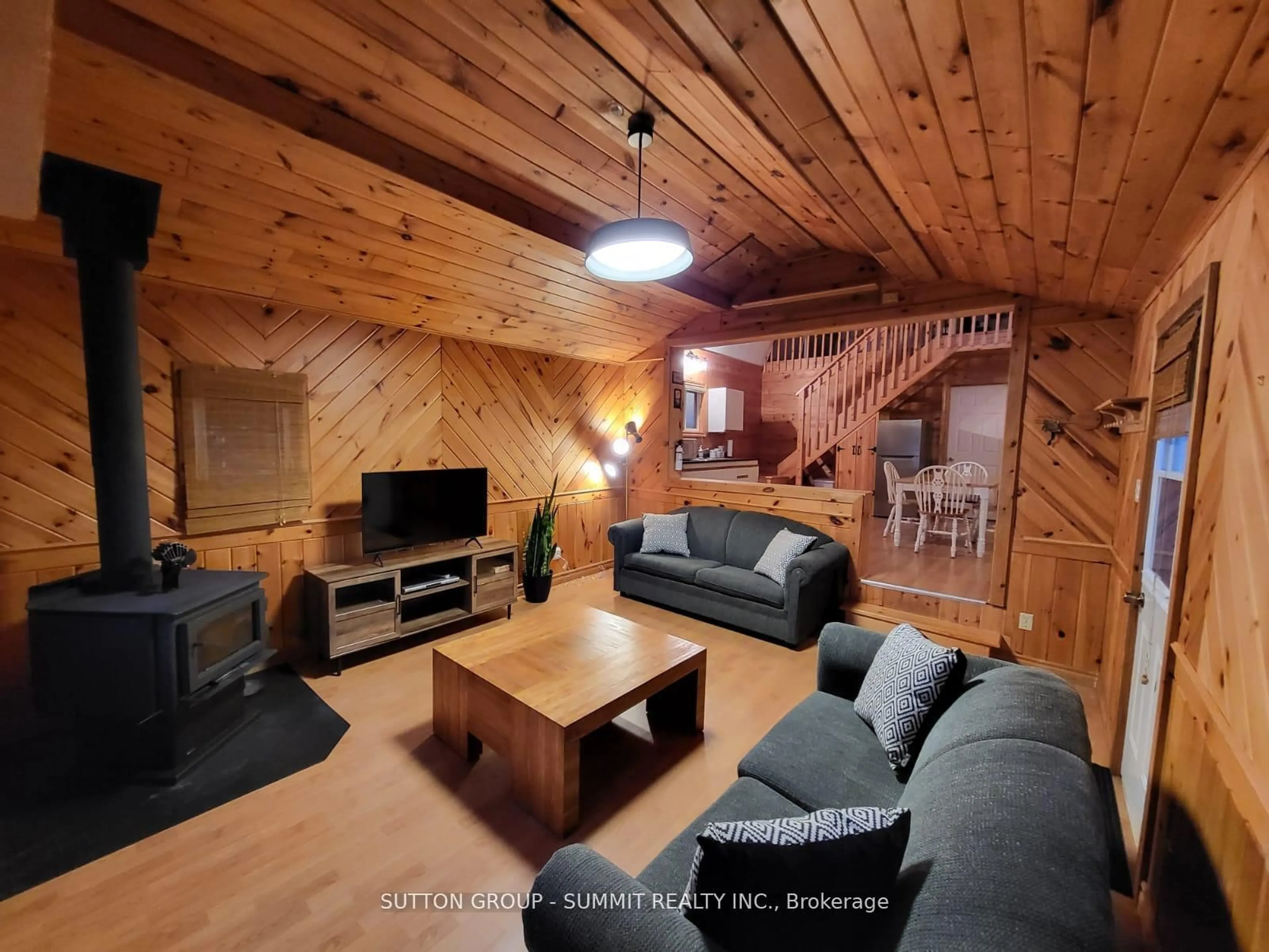 Living room with furniture, wood/laminate floor for 98 West Ham Lake Rd, Killarney Ontario P0M 1A0