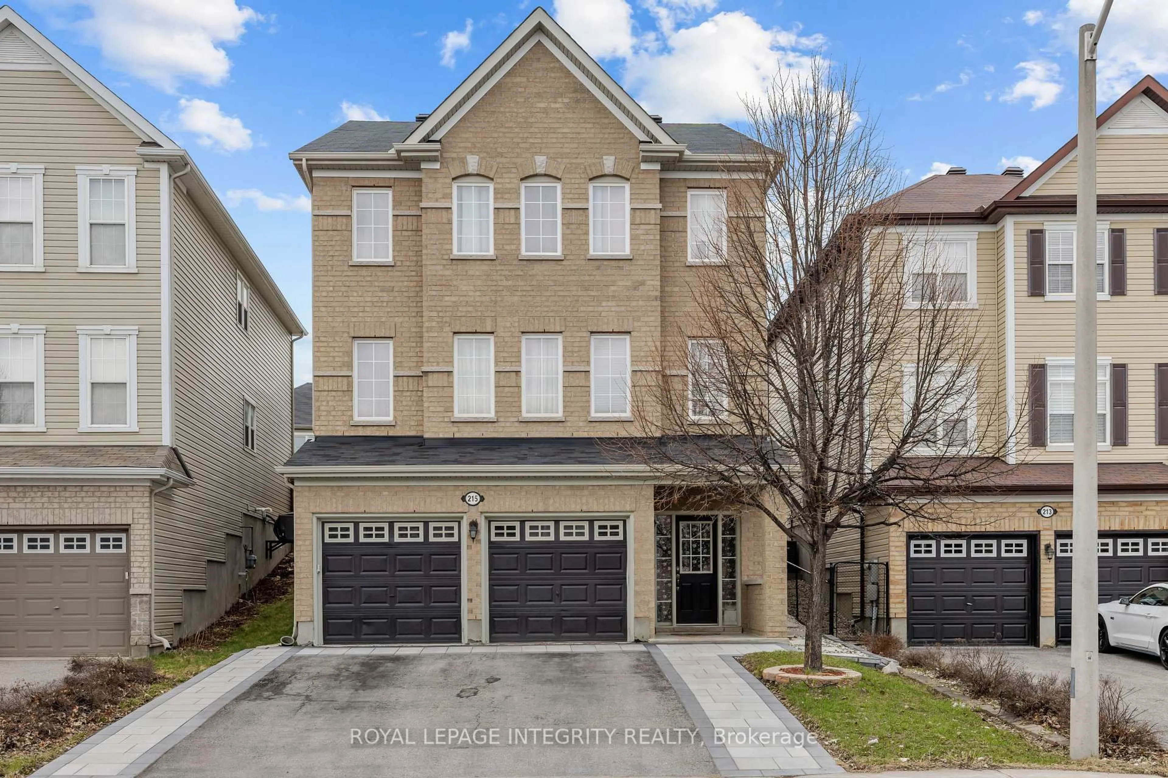 Home with brick exterior material, street for 215 Huntsville Dr, Ottawa Ontario K2T 0C7