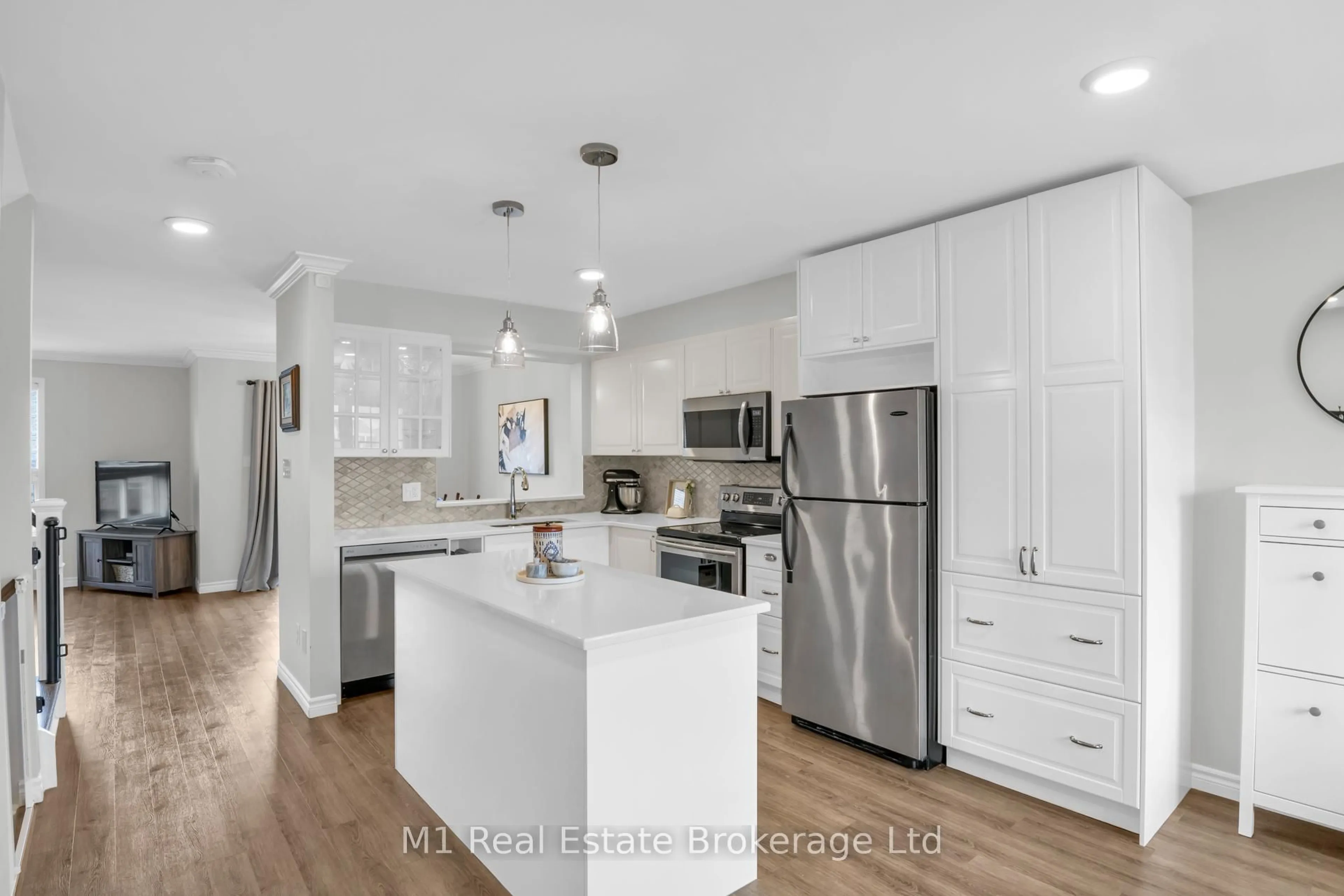 Open concept kitchen, wood/laminate floor for 90 Cedarvale Ave, Guelph Ontario N1E 7K2